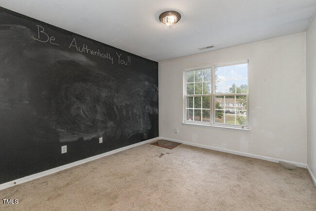 508 Summer Breeze Drive Durham, NC 27704 - Photo 22 of 28 a view of an empty room with a window