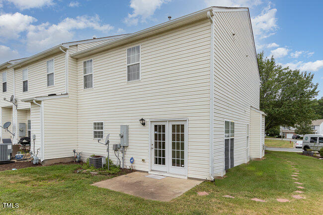 508 Summer Breeze Drive Durham, NC 27704 - Photo 24 of 28 a view of a white house with a yard