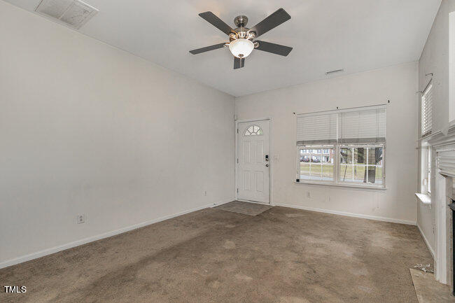 508 Summer Breeze Drive Durham, NC 27704 - Photo 5 of 28 a view of an empty room with a window
