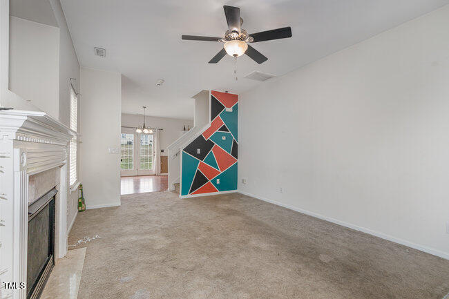 508 Summer Breeze Drive Durham, NC 27704 - Photo 7 of 28 a view of an empty room with a fireplace