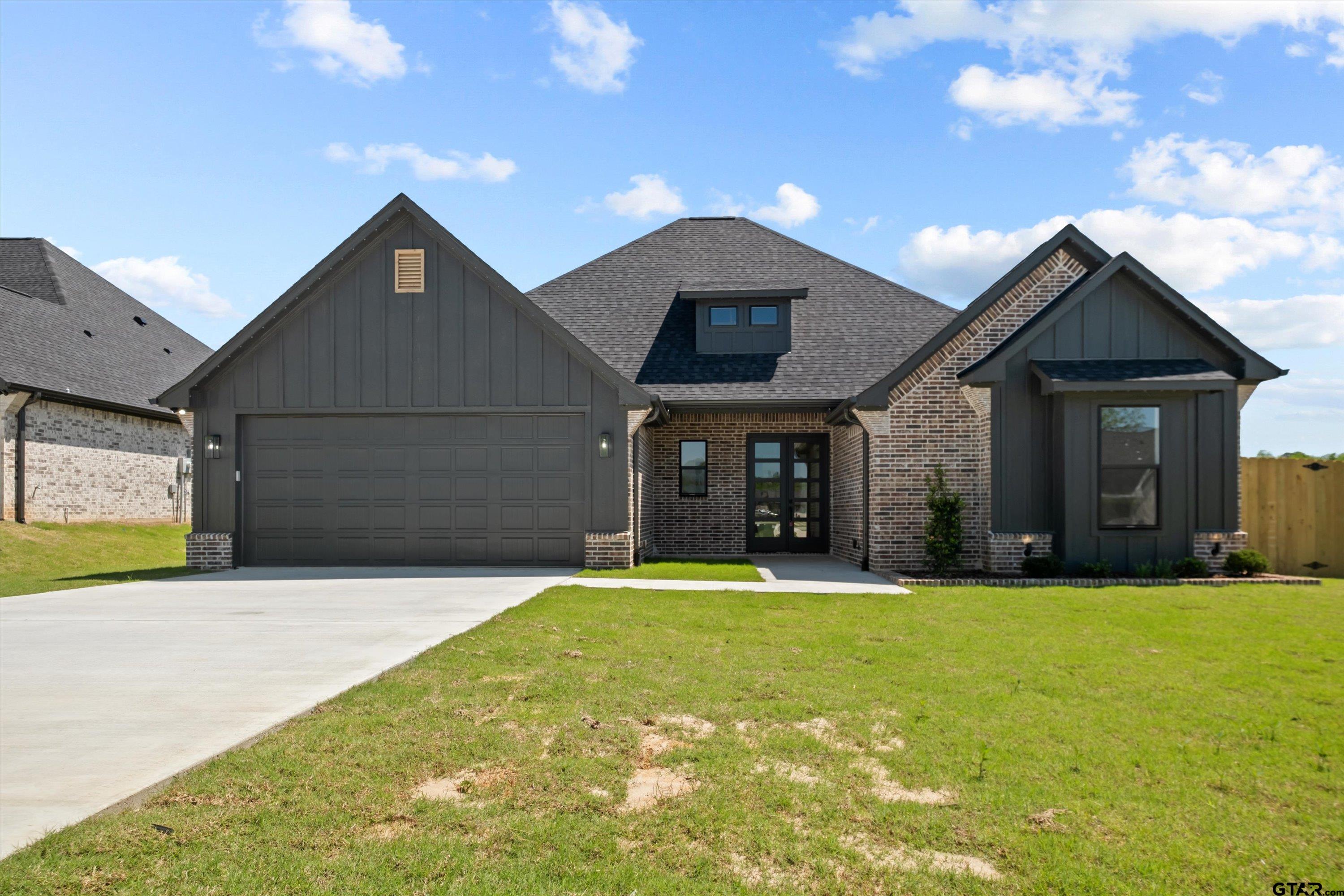 17762 Jayleen Lane Tyler, TX 75707 - Photo 1 of 24 a front view of a house with a yard and garage