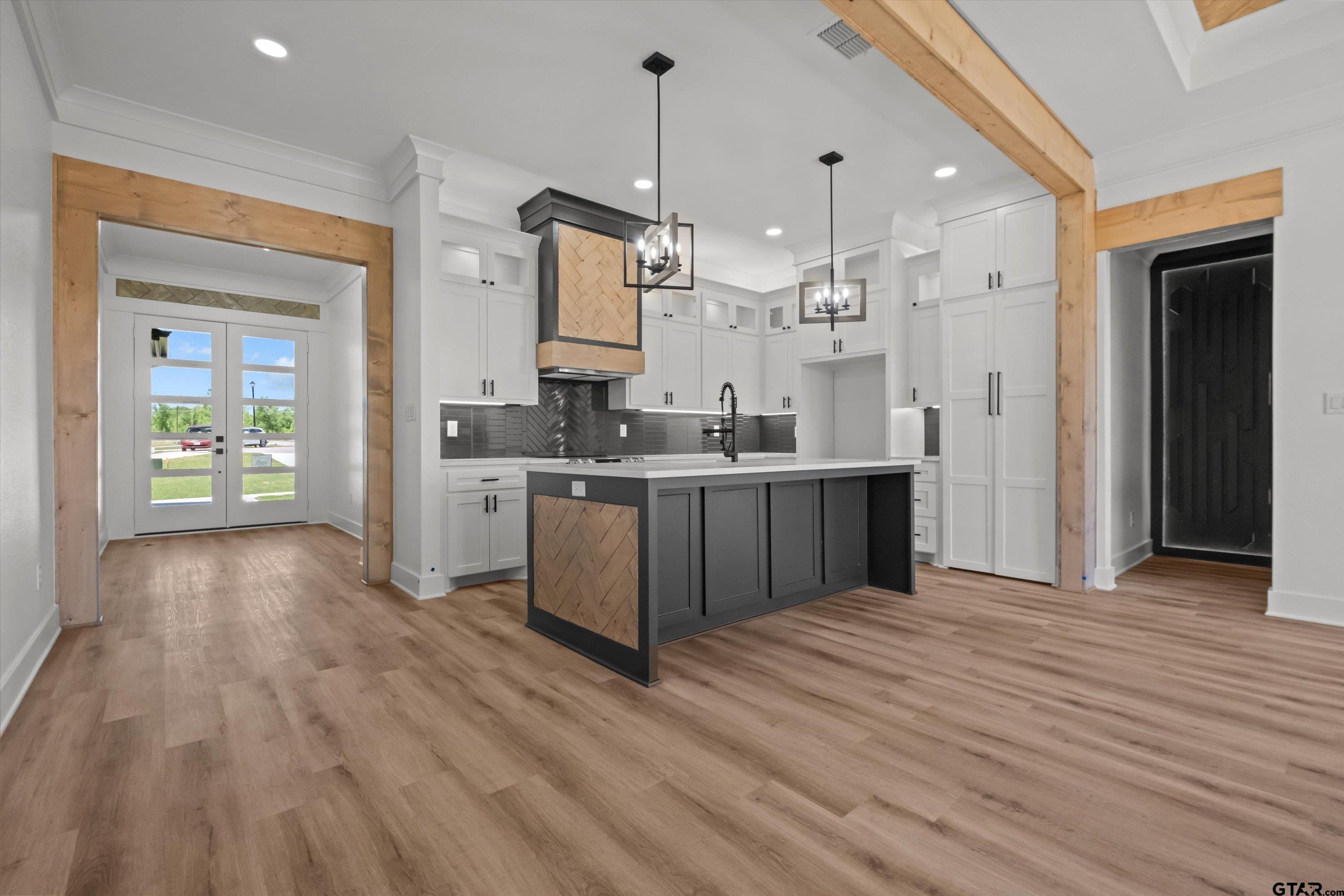 17762 Jayleen Lane Tyler, TX 75707 - Photo 13 of 24 a large kitchen with cabinets a sink and stainless steel appliances