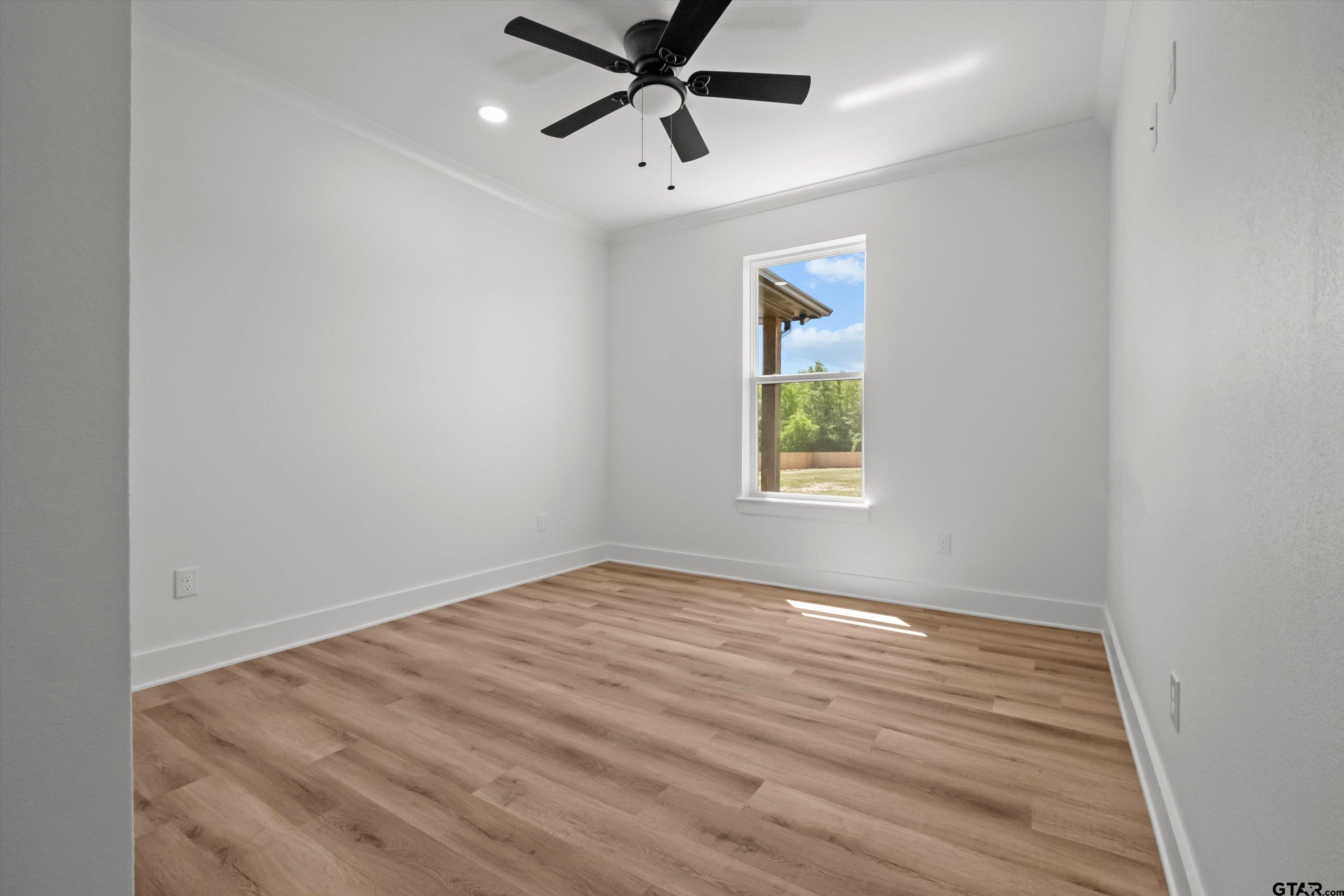 17762 Jayleen Lane Tyler, TX 75707 - Photo 17 of 24 wooden floor in an empty room with a window