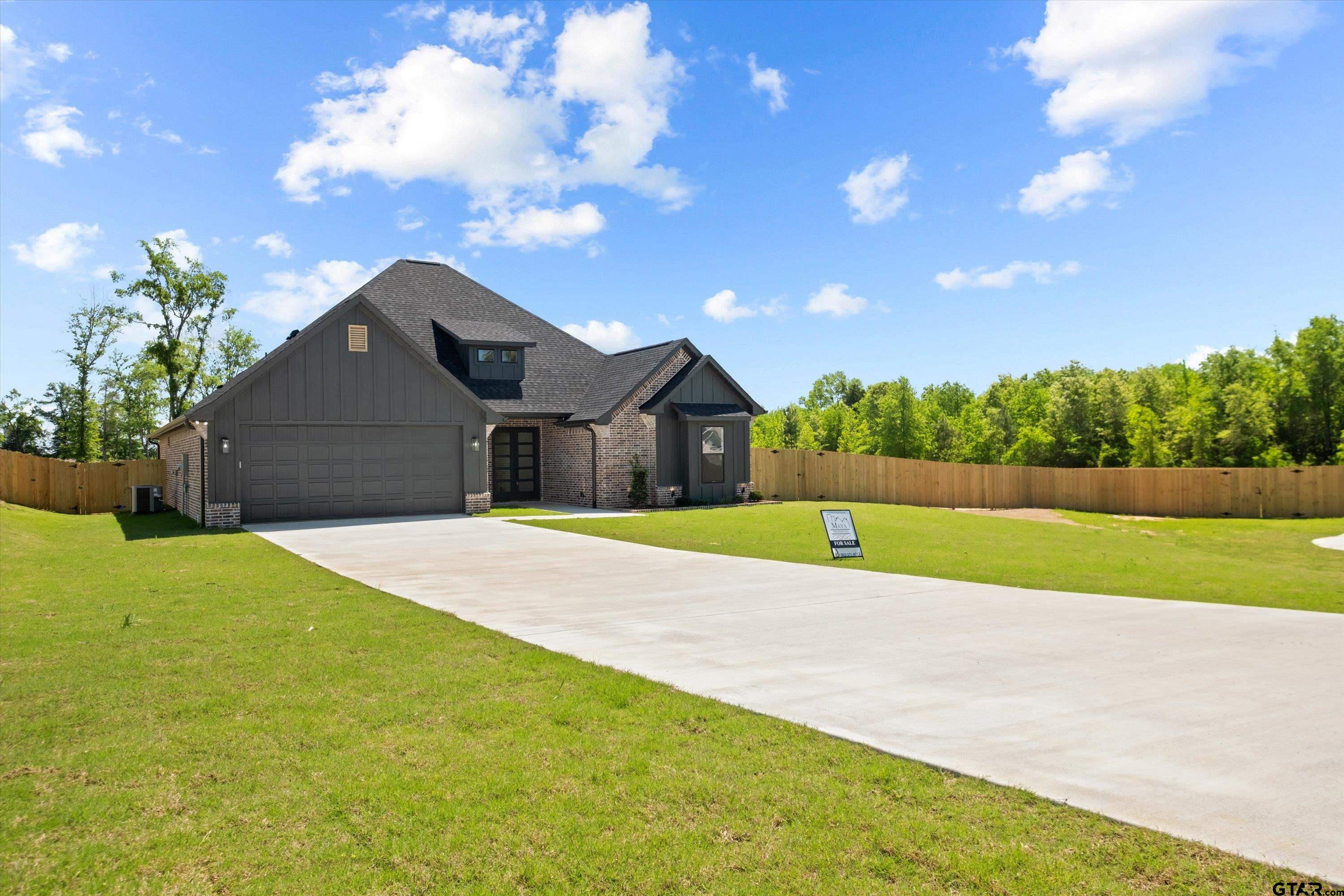 17762 Jayleen Lane Tyler, TX 75707 - Photo 2 of 24 a house view with a garden space