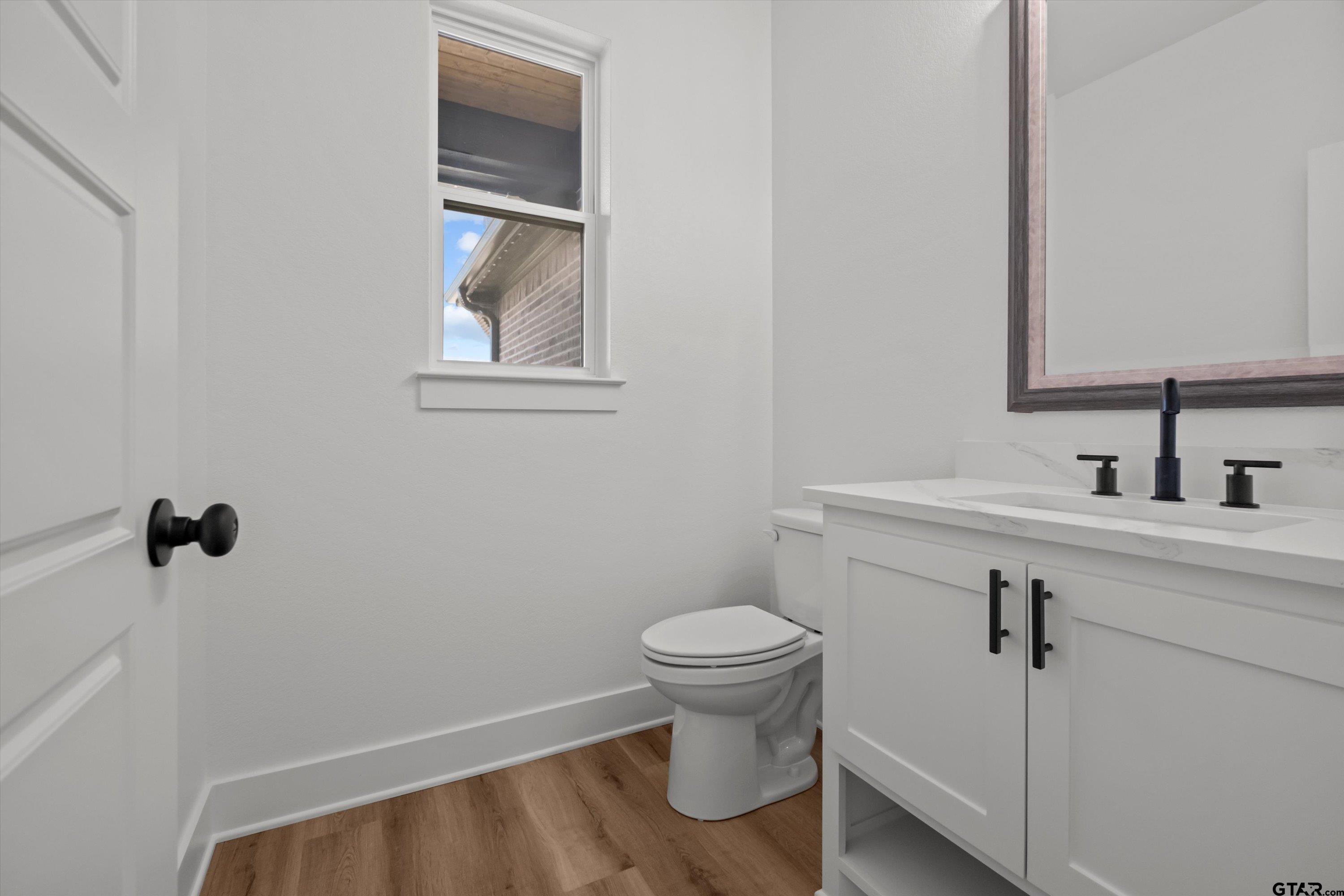 17762 Jayleen Lane Tyler, TX 75707 - Photo 23 of 24 a bathroom with a sink toilet and vanity