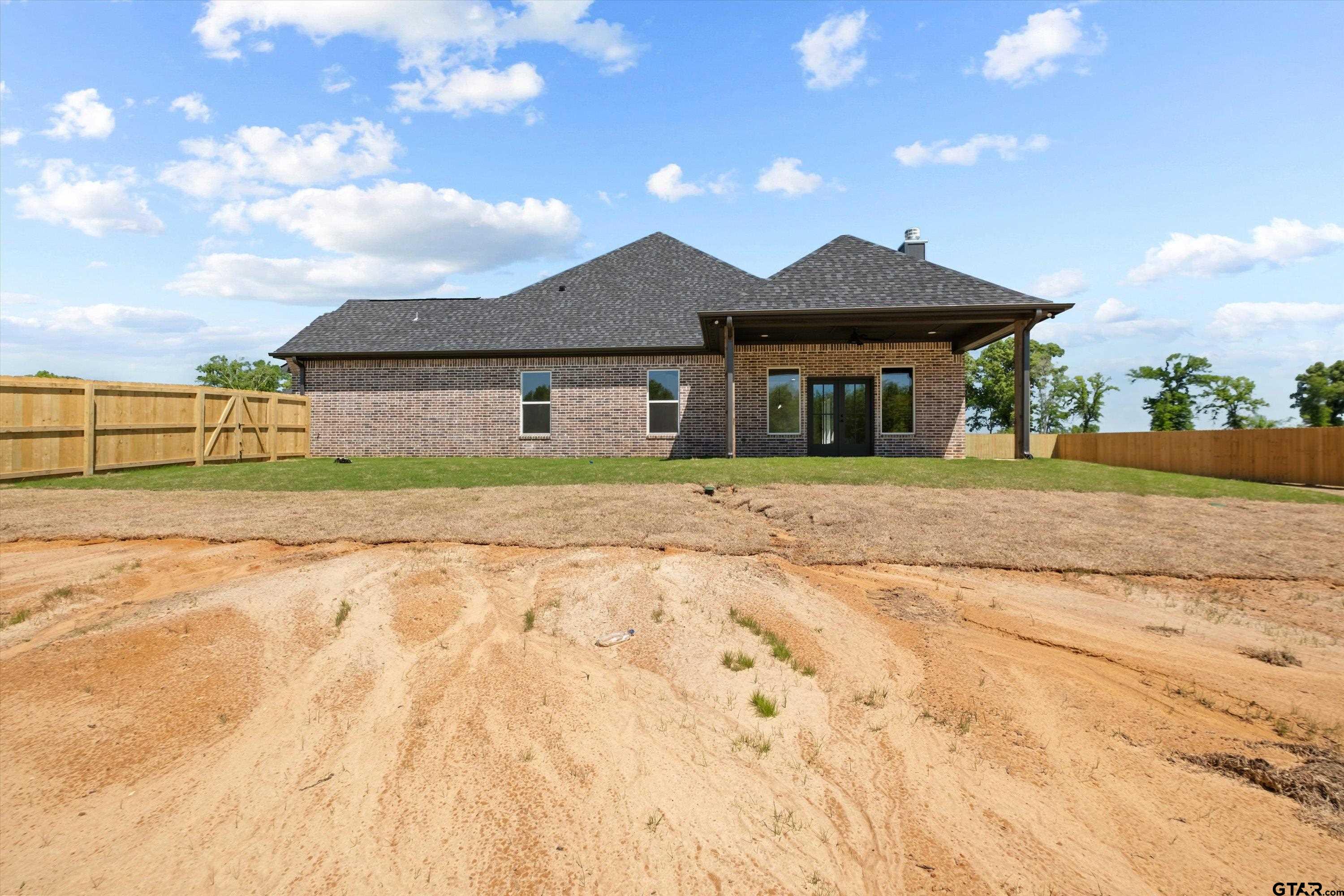 17762 Jayleen Lane Tyler, TX 75707 - Photo 5 of 24 a front view of a house with a yard