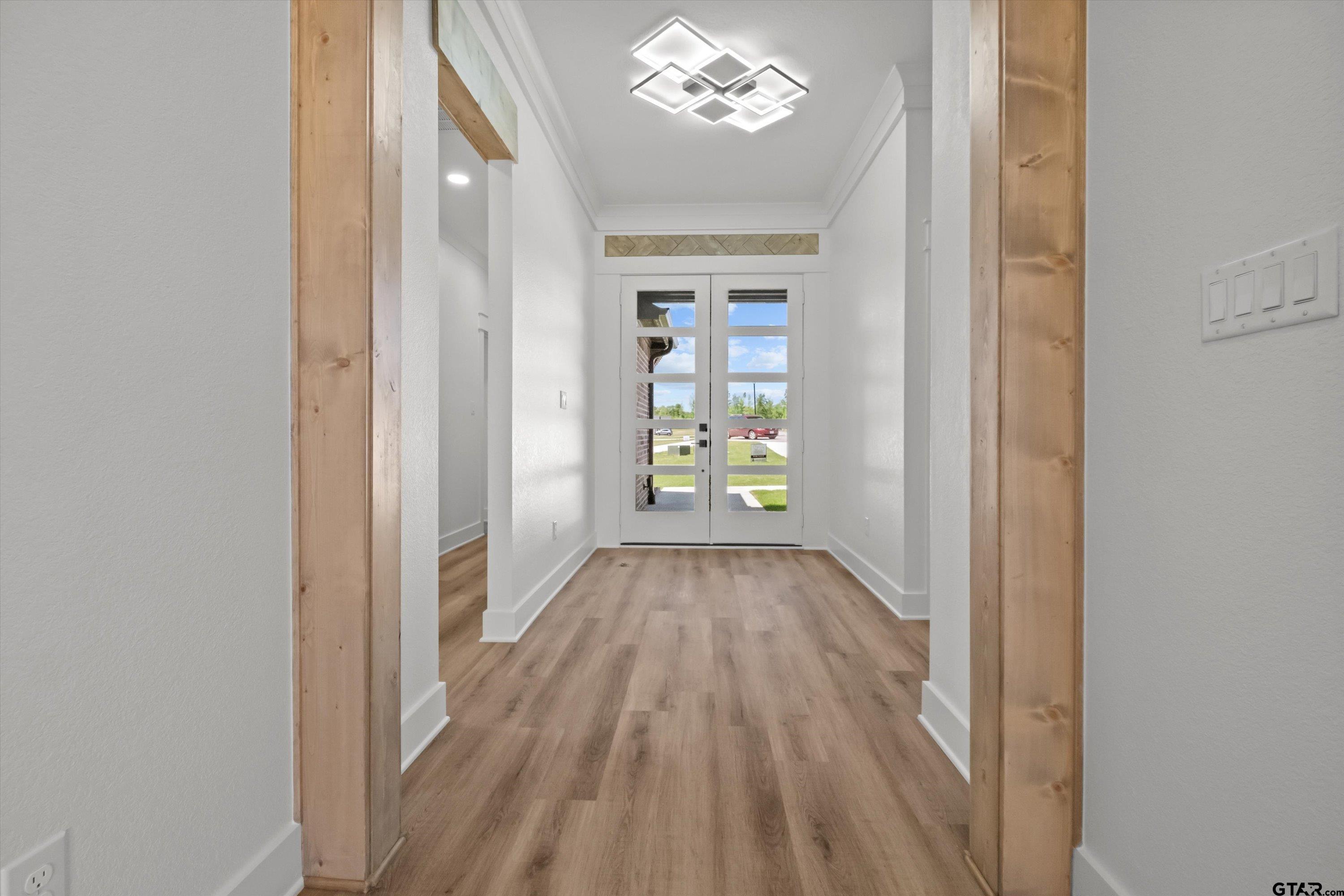 17762 Jayleen Lane Tyler, TX 75707 - Photo 7 of 24 a view of an empty room with a window and wooden floor