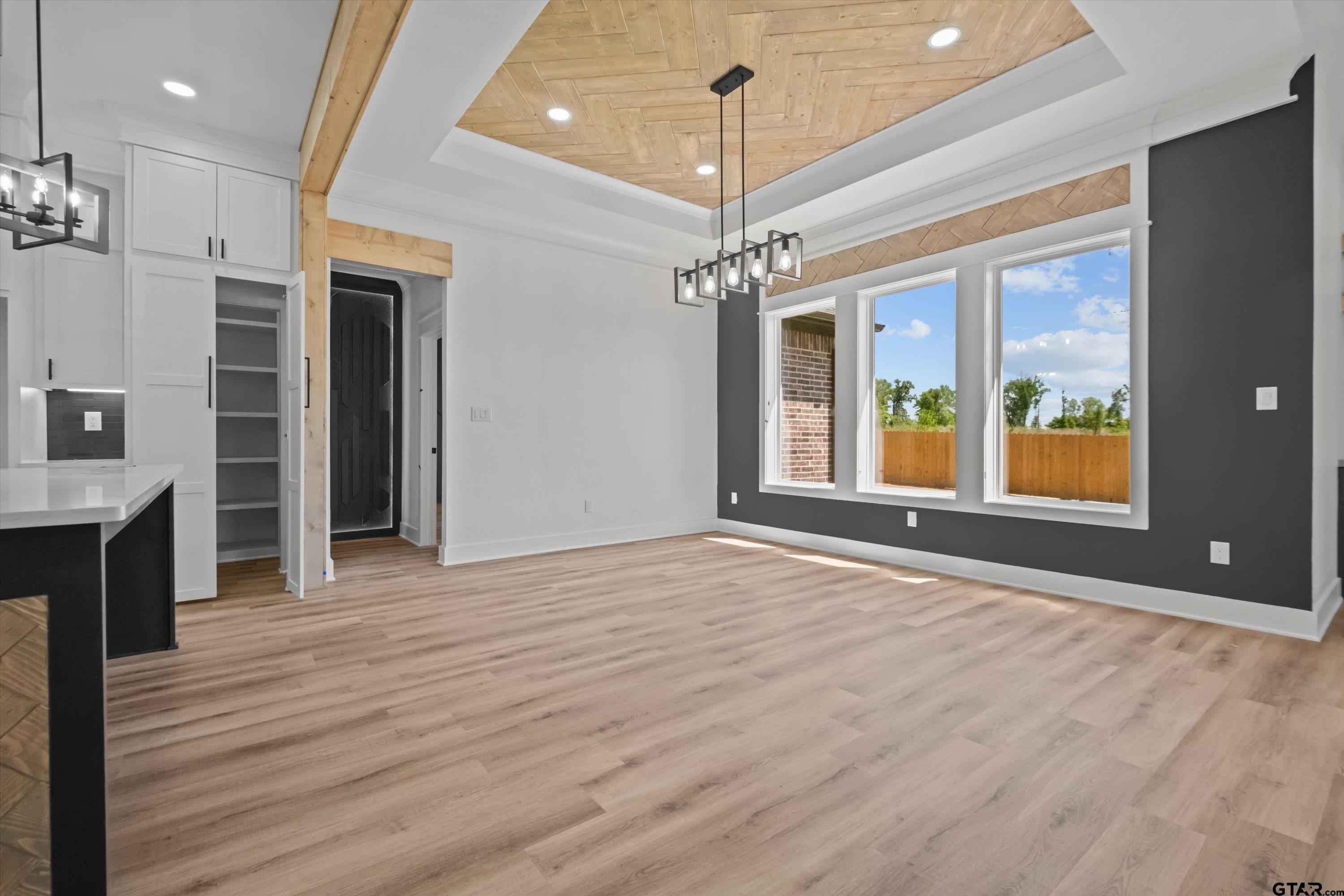 17762 Jayleen Lane Tyler, TX 75707 - Photo 9 of 24 a view of an empty room with wooden floor fireplace and a window