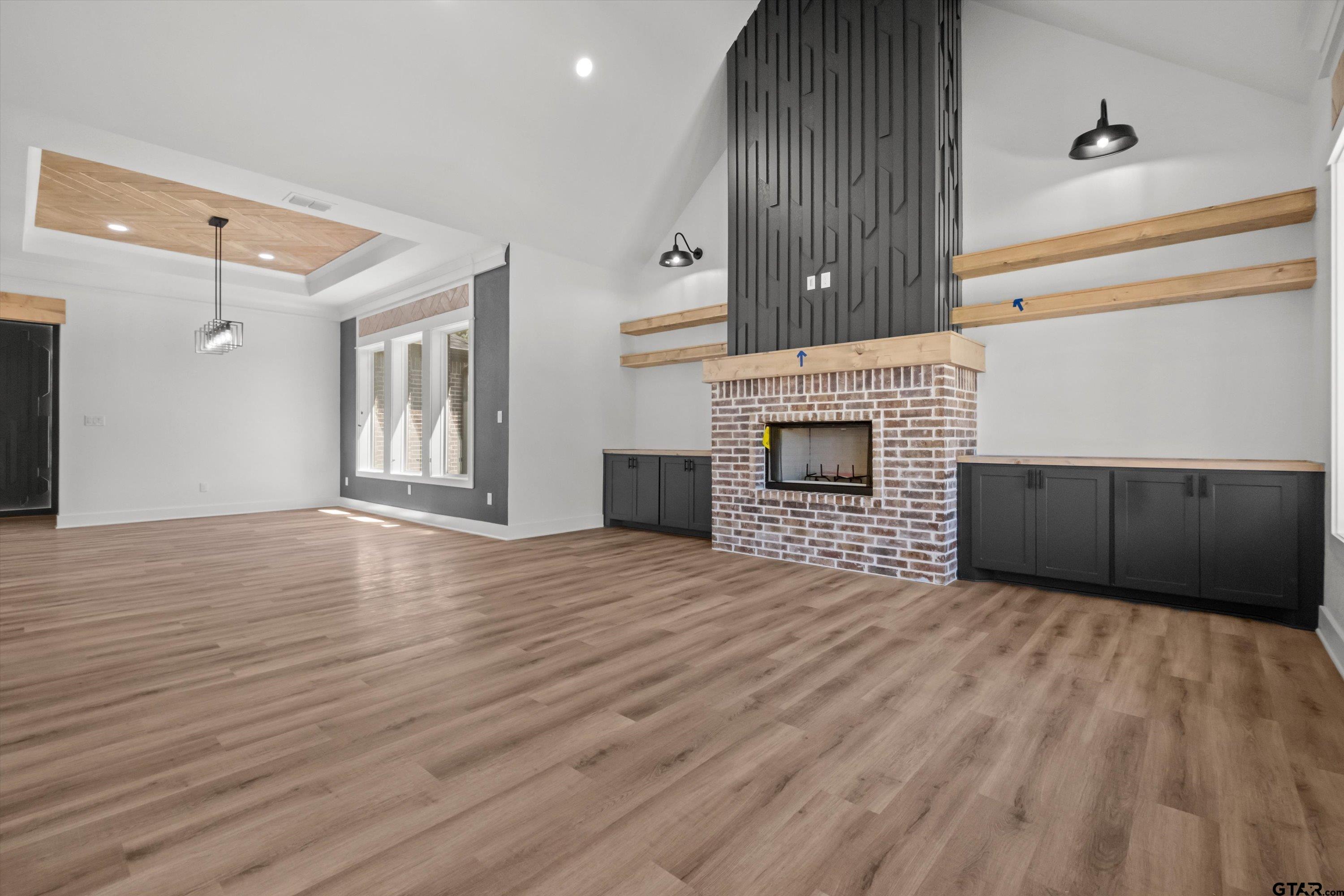 17762 Jayleen Lane Tyler, TX 75707 - Photo 10 of 24 a view of empty room with wooden floor and fireplace