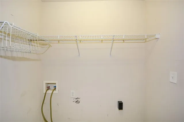 a bathroom with a bathtub and a window