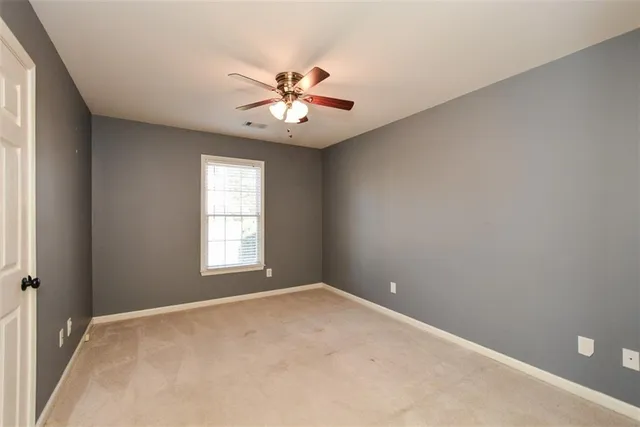 a view of swimming pool with lounge chair and dinning table under an umbrella