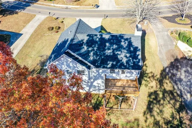 a view of yard with swimming pool and green space