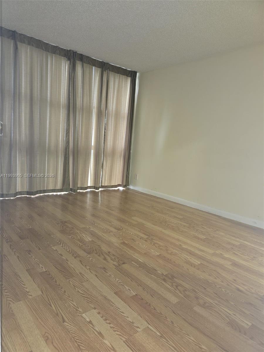 17021 North Bay Road, Unit 225 Sunny Isles Beach, FL 33160 - Photo 12 of 24 a view of entryway with wooden floor