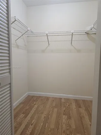 a view of a room with racks on the wall