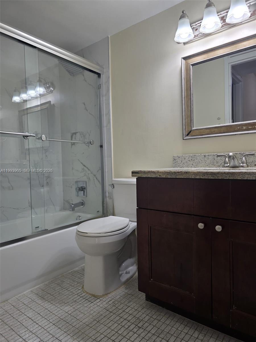 17021 North Bay Road, Unit 225 Sunny Isles Beach, FL 33160 - Photo 14 of 24 a bathroom with a sink toilet and shower