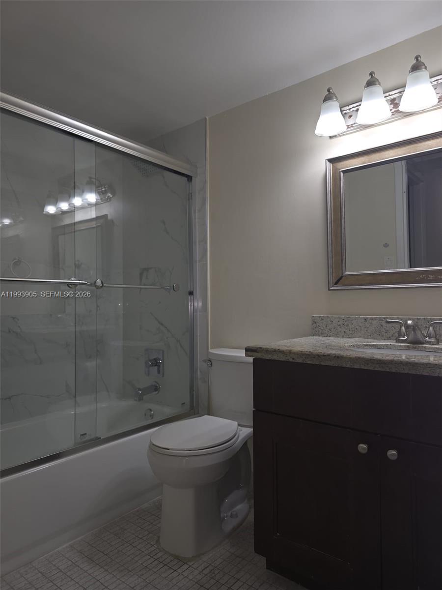 17021 North Bay Road, Unit 225 Sunny Isles Beach, FL 33160 - Photo 15 of 24 a bathroom with a sink a toilet and shower