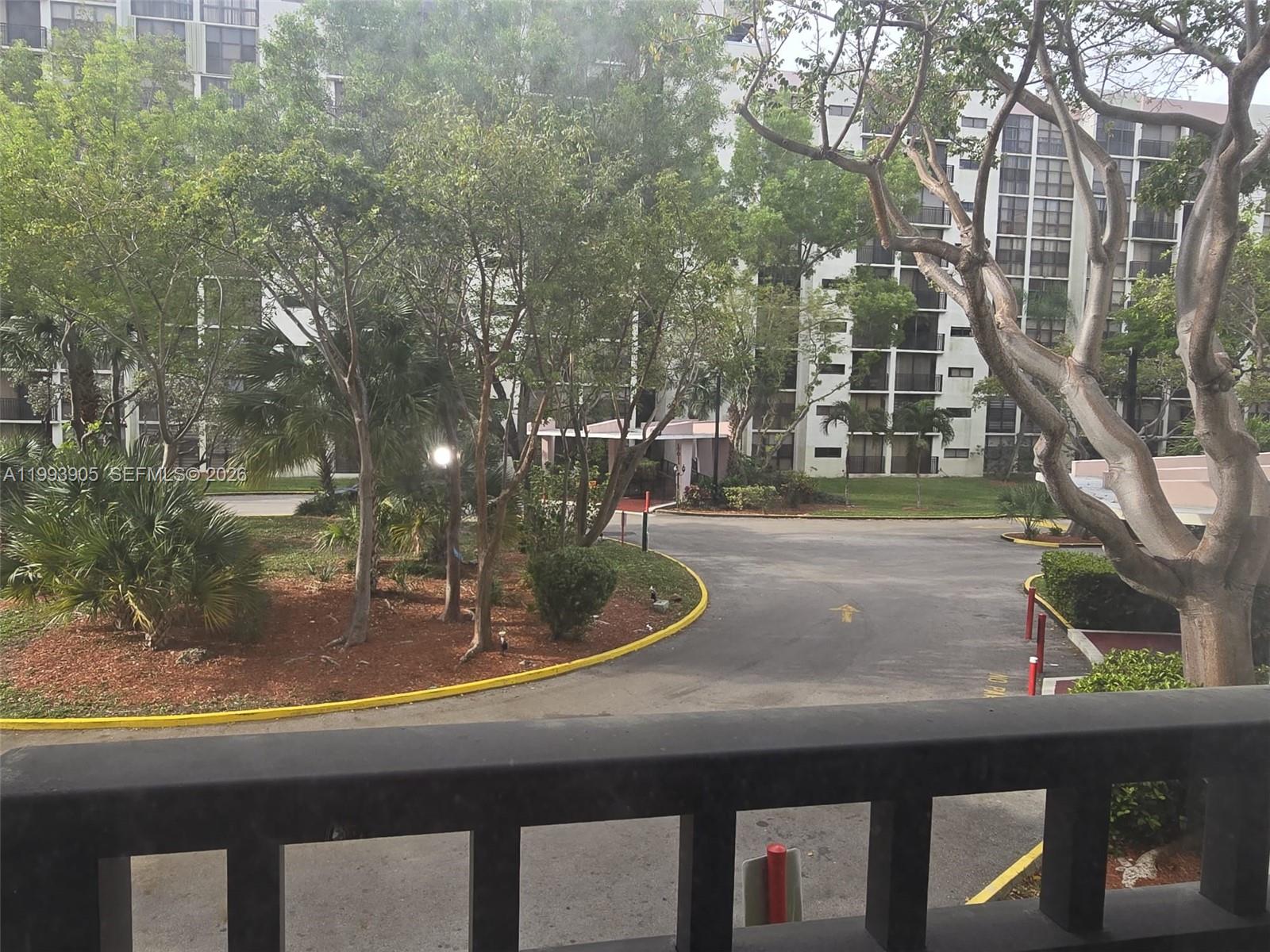 17021 North Bay Road, Unit 225 Sunny Isles Beach, FL 33160 - Photo 17 of 24 a view of a house with a yard