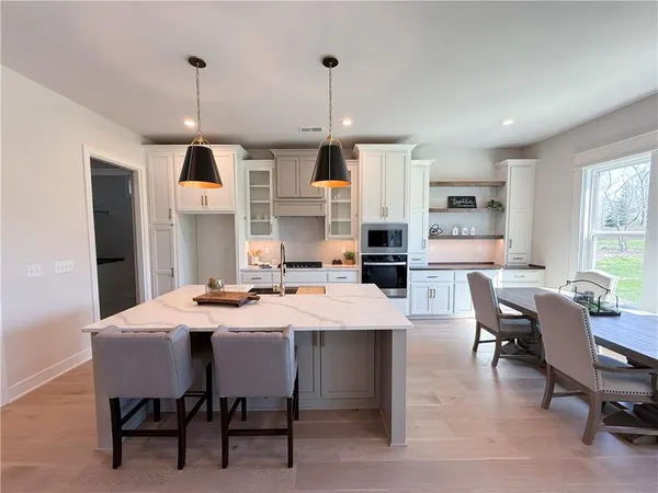 $700,000 | 2624 Northeast Woodland Oak Drive, Lee's Summit, MO 64086