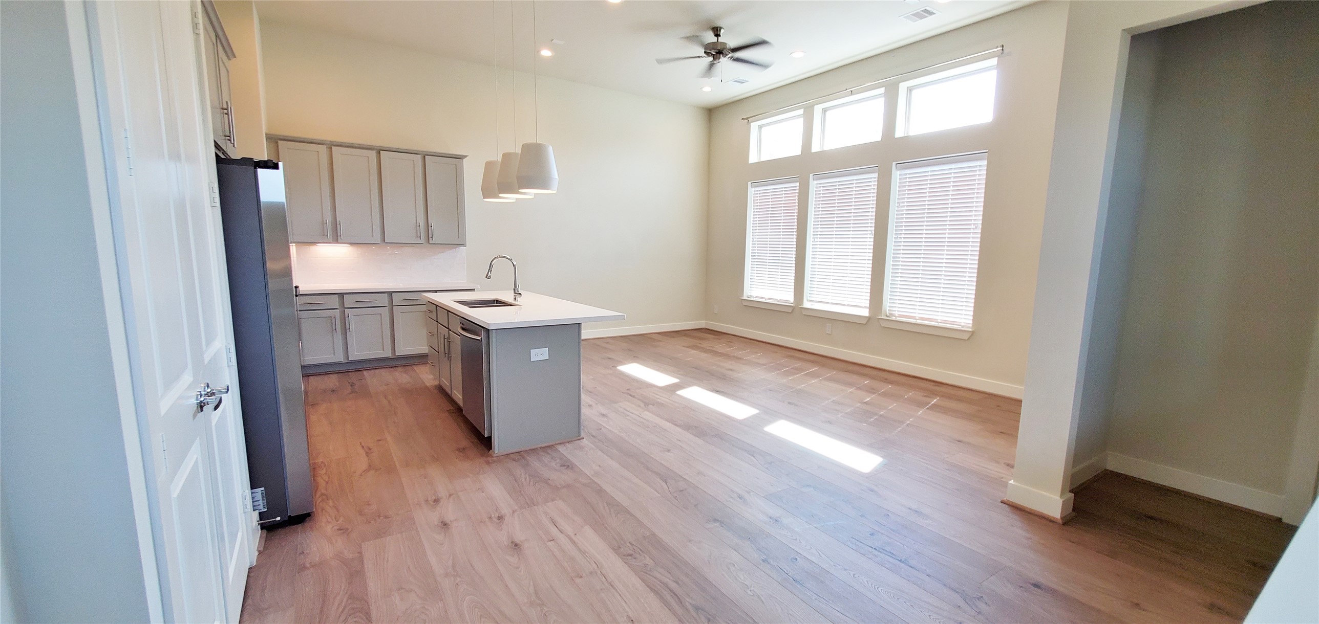 2980 Alice Street Houston, TX 77054 - Photo 7 of 20 a kitchen with stainless steel appliances granite countertop wooden floors and sink