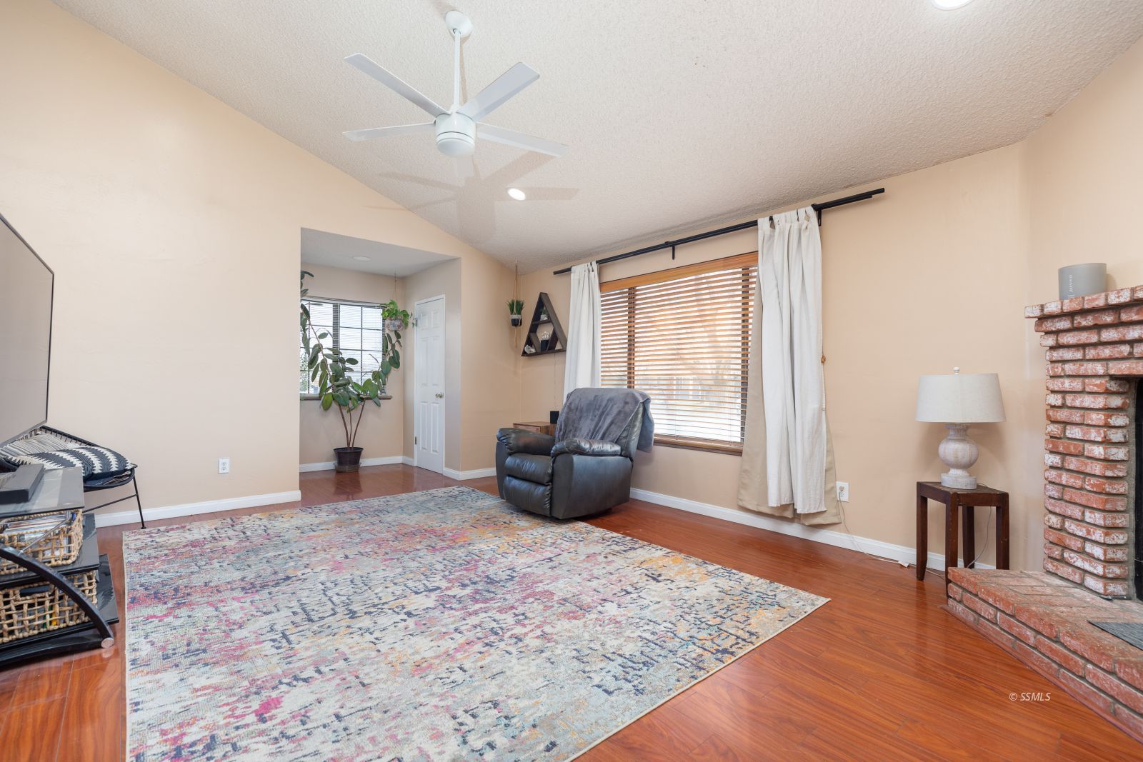 331 Henry Street Ridgecrest, CA 93555 - Photo 6 of 30 a living room with furniture and a wooden floor