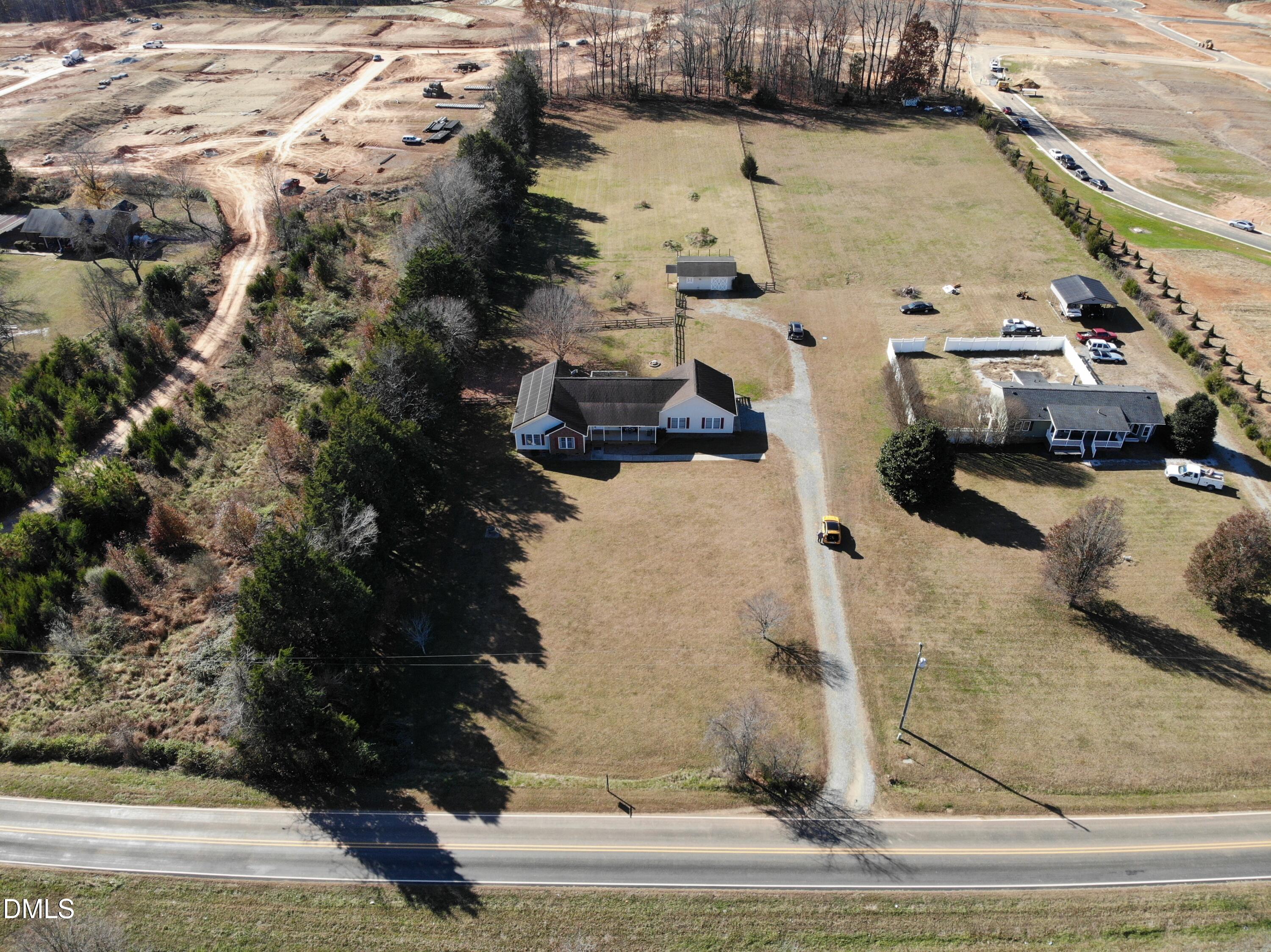 1722 Saddle Club Road Mebane, NC 27302 - Photo 2 of 37 an aerial view of a house with a yard