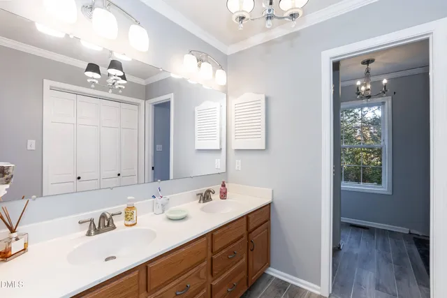 a bathroom with a sink double vanity and a mirror
