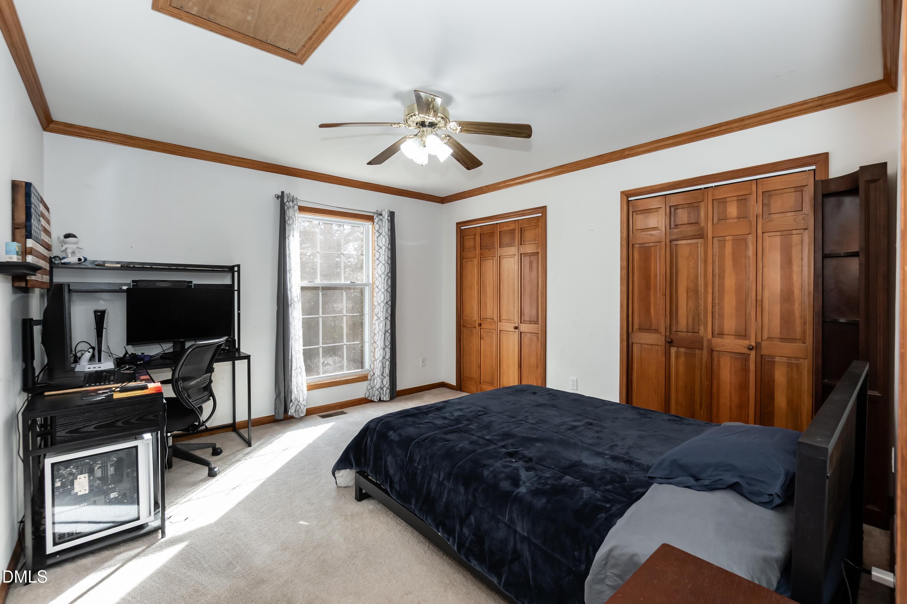 1722 Saddle Club Road Mebane, NC 27302 - Photo 25 of 37 a bedroom with a bed and a flat screen tv