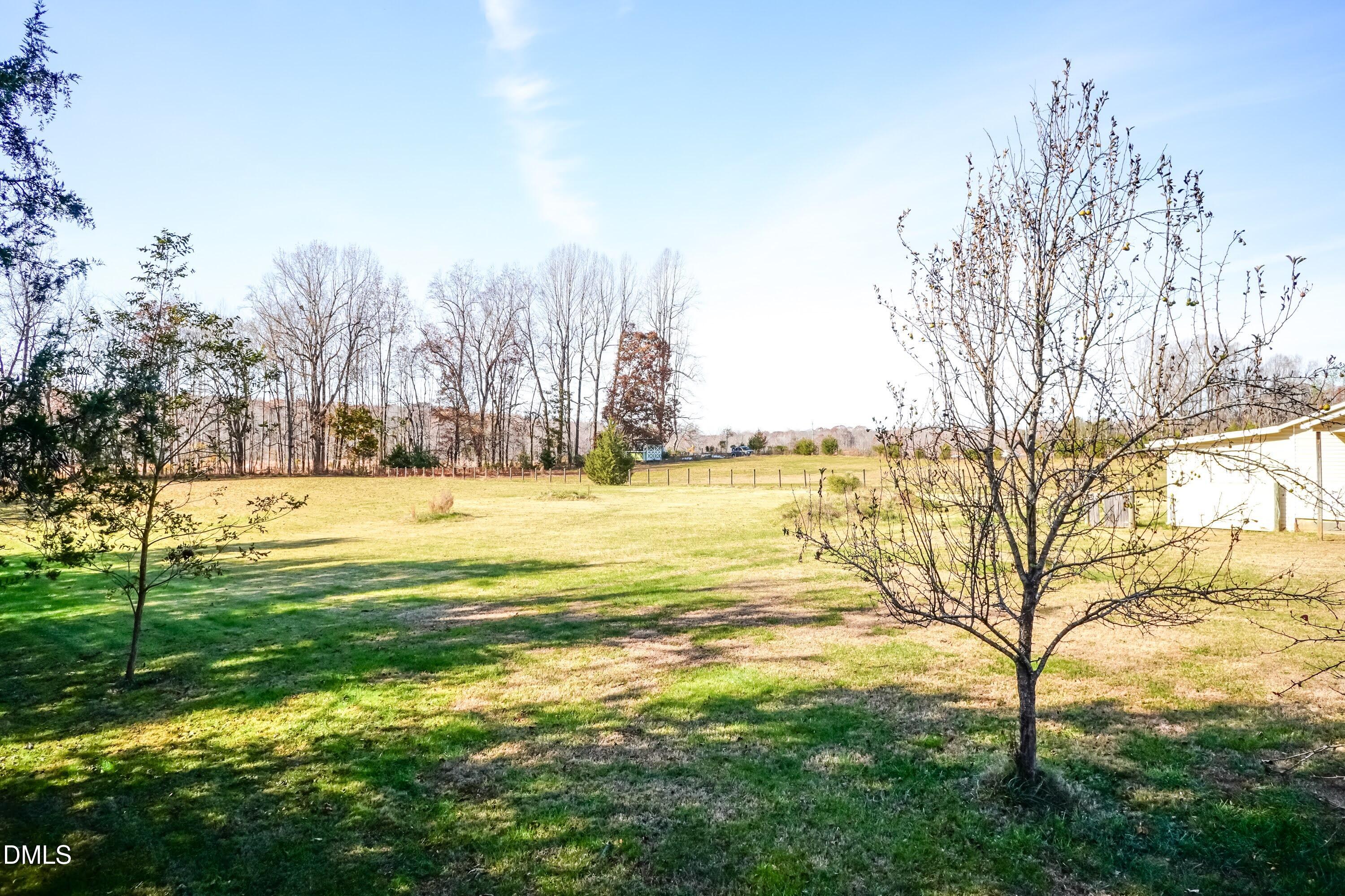 1722 Saddle Club Road Mebane, NC 27302 - Photo 29 of 37 a view of a yard with swimming pool and trees