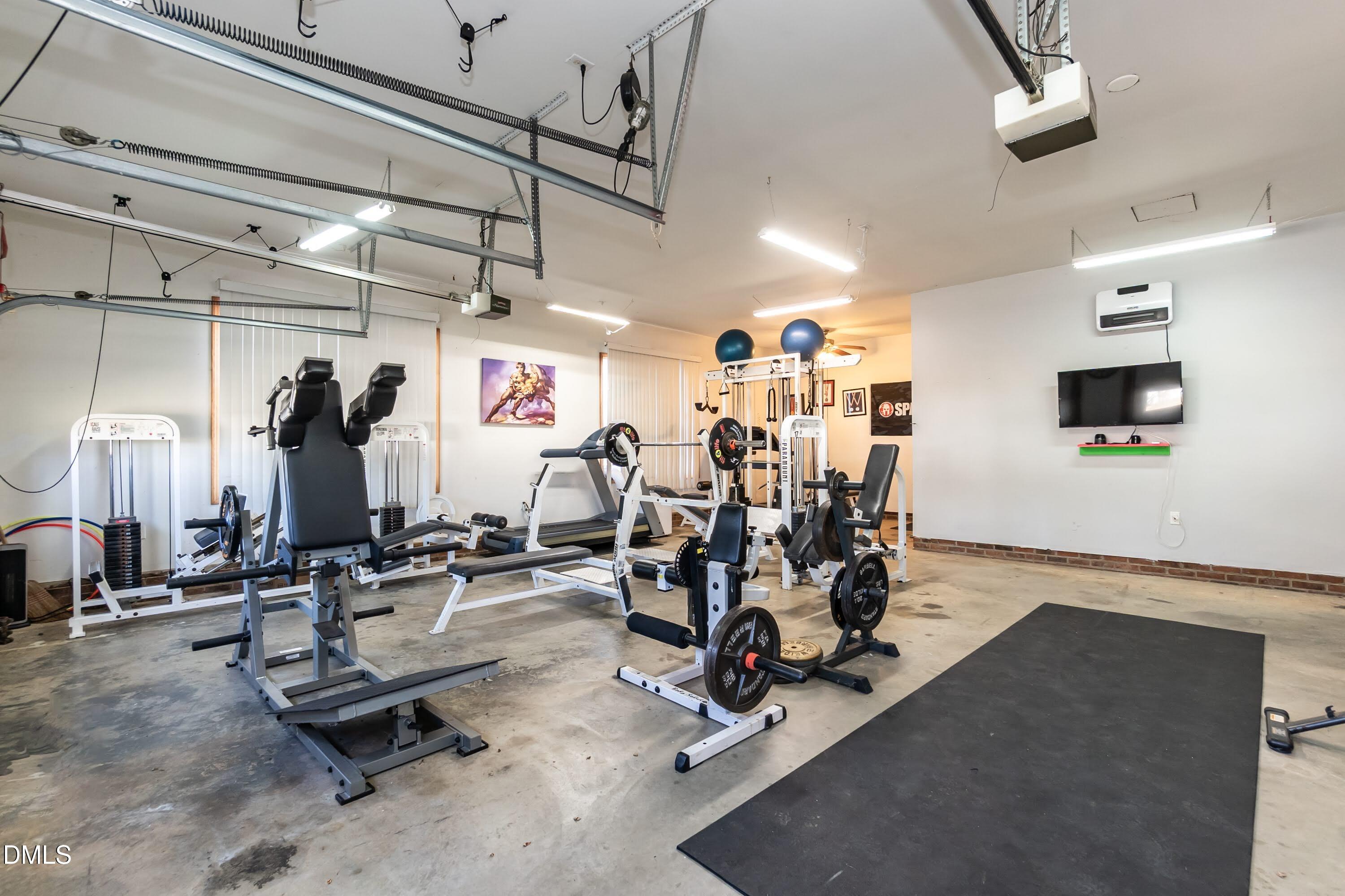 1722 Saddle Club Road Mebane, NC 27302 - Photo 32 of 37 a view of a room with gym equipment