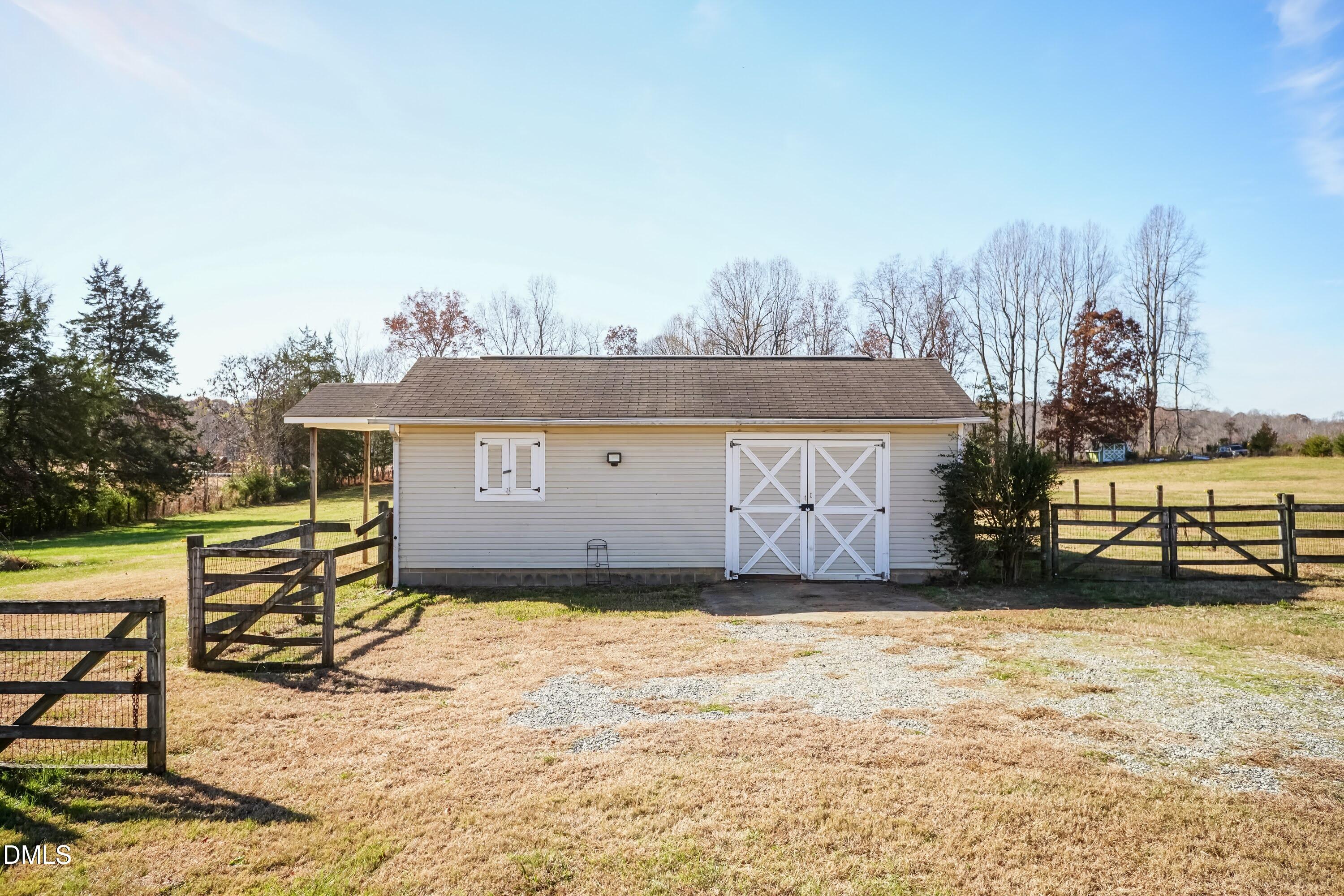 1722 Saddle Club Road Mebane, NC 27302 - Photo 33 of 37 a view of a terrace with a bench