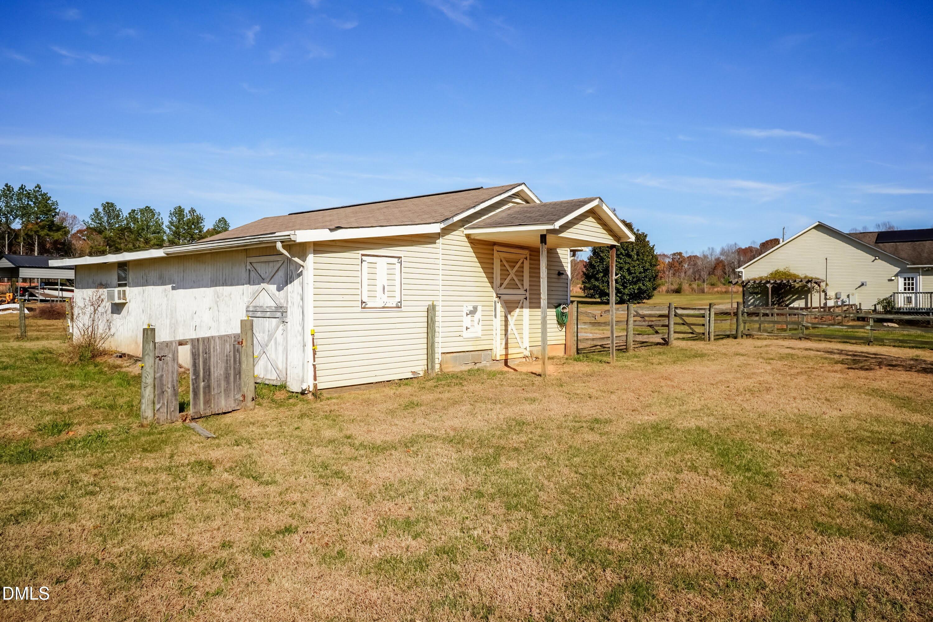 1722 Saddle Club Road Mebane, NC 27302 - Photo 34 of 37 a view of a large house with a yard