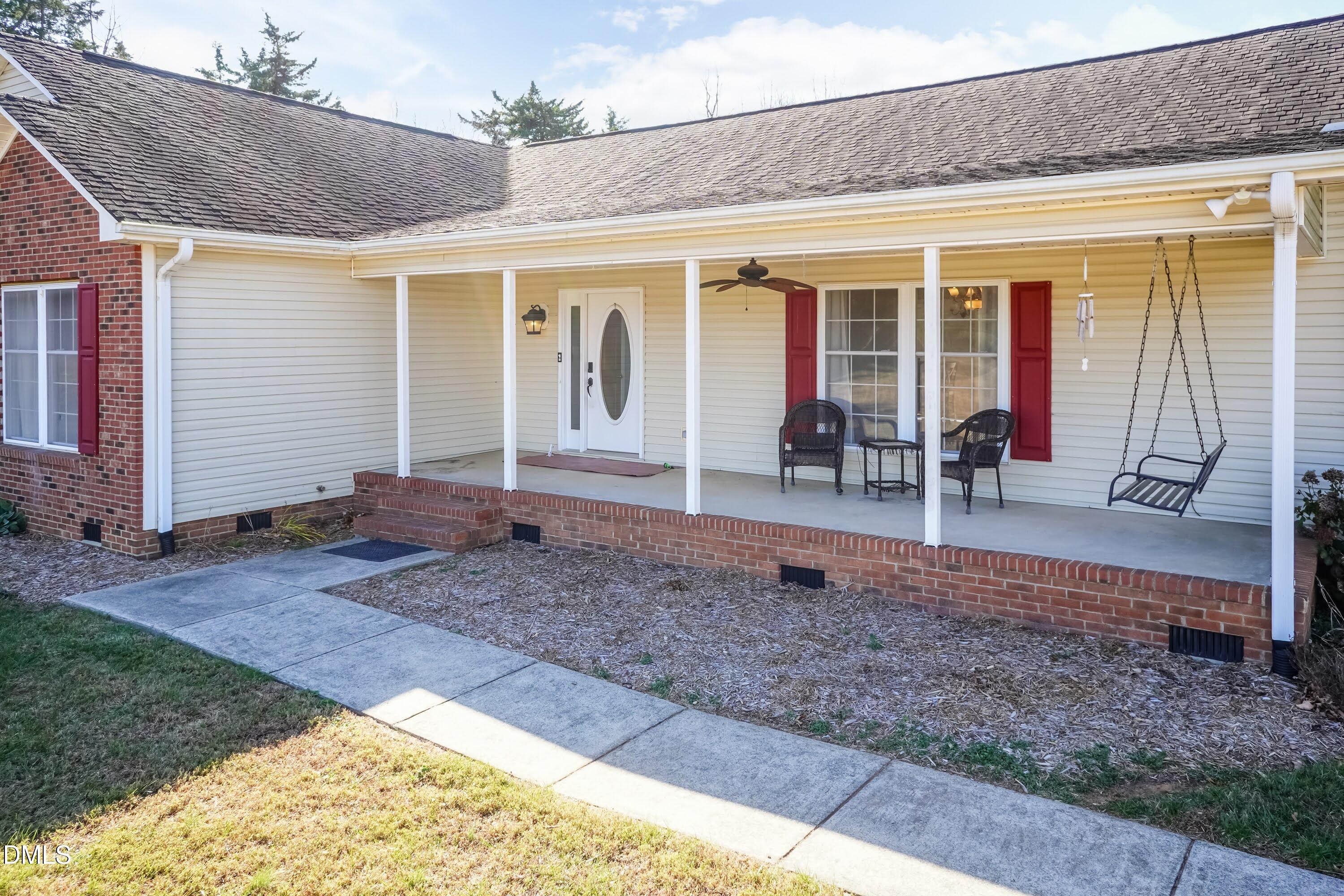 1722 Saddle Club Road Mebane, NC 27302 - Photo 4 of 37 a view of a house with a porch