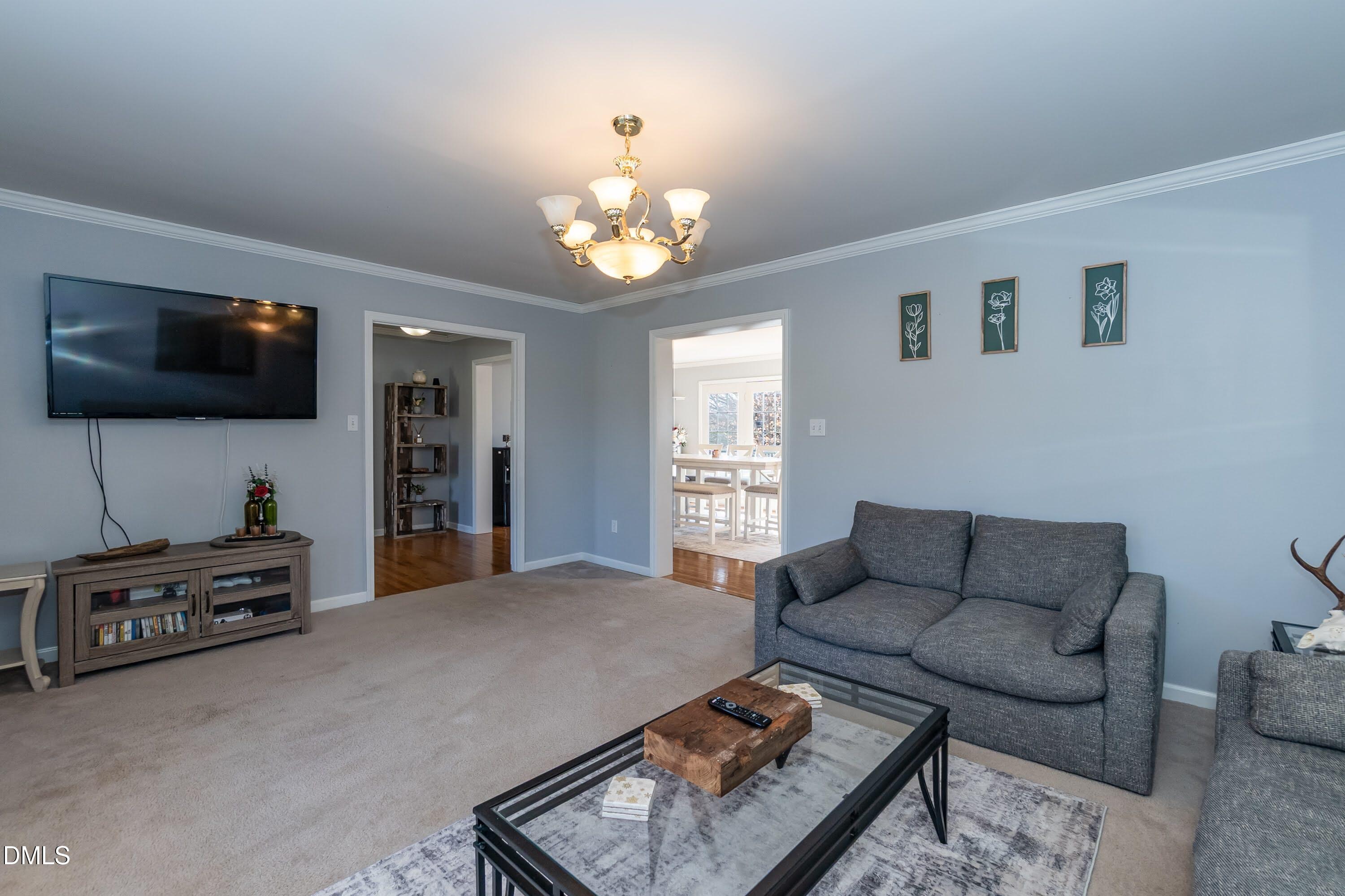 1722 Saddle Club Road Mebane, NC 27302 - Photo 8 of 37 a living room with furniture and a flat screen tv