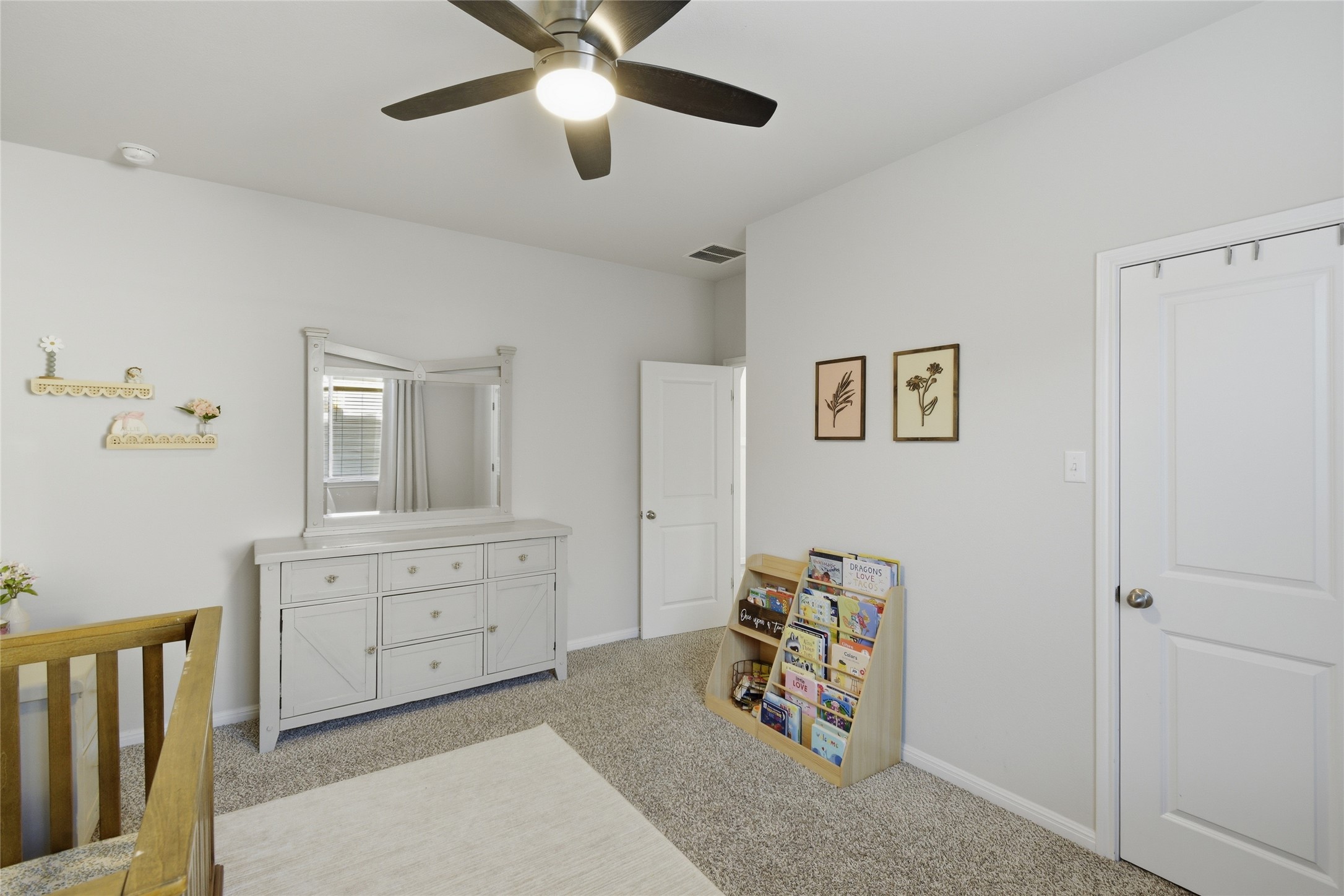 8152 Daisy Cutter Crossing Georgetown, TX 78626 - Photo 14 of 23 a view of a bedroom with furniture and a ceiling fan