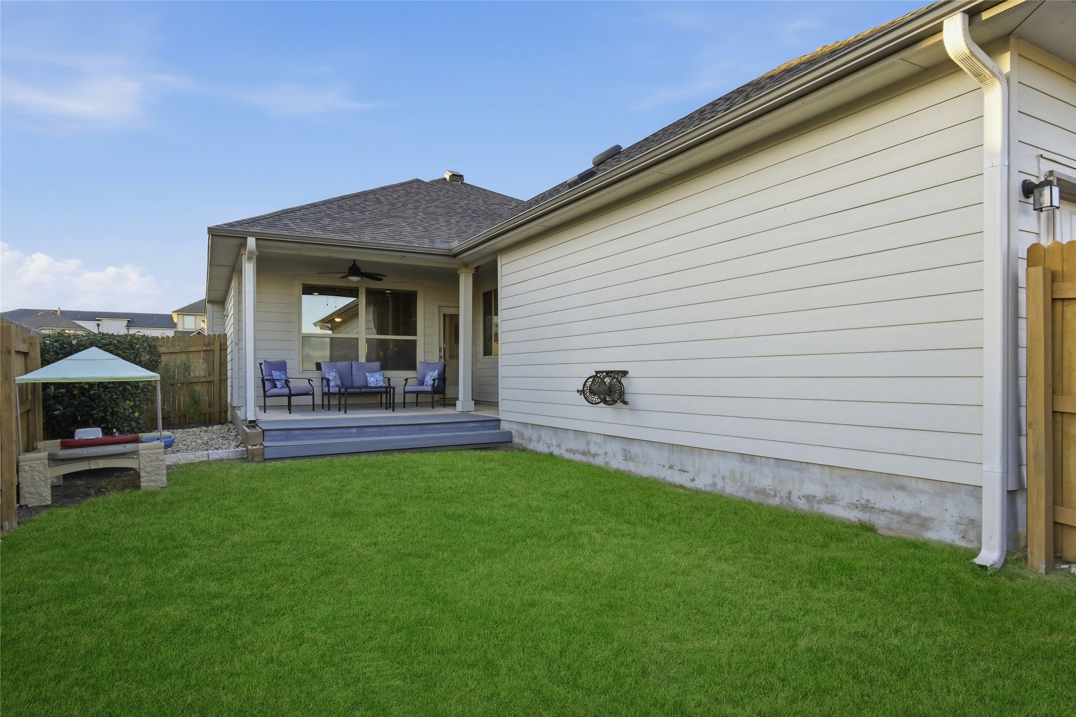 8152 Daisy Cutter Crossing Georgetown, TX 78626 - Photo 17 of 23 a view of a backyard with a garden and plants
