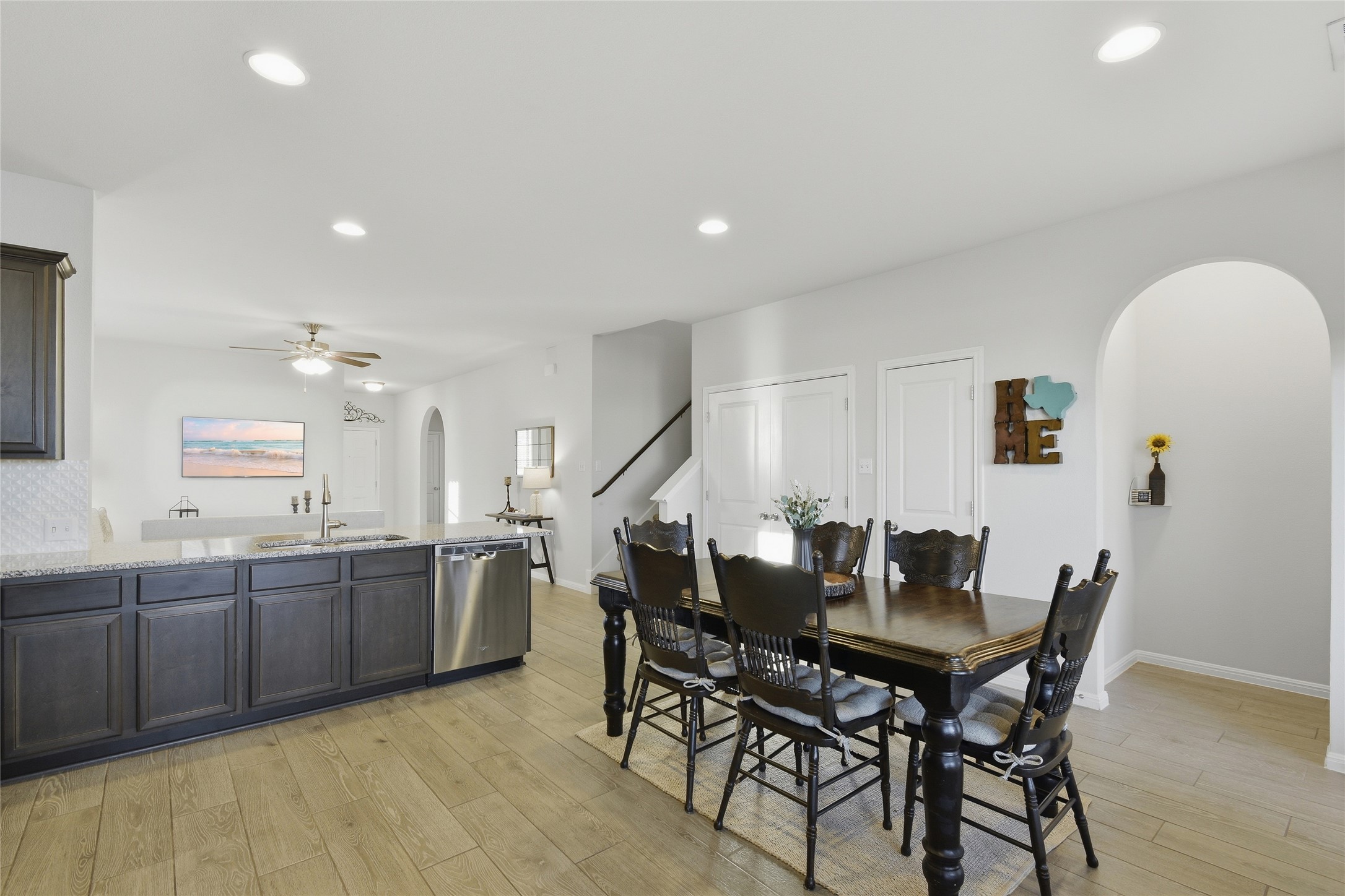 8152 Daisy Cutter Crossing Georgetown, TX 78626 - Photo 4 of 23 a view of a dining room with furniture and wooden floor