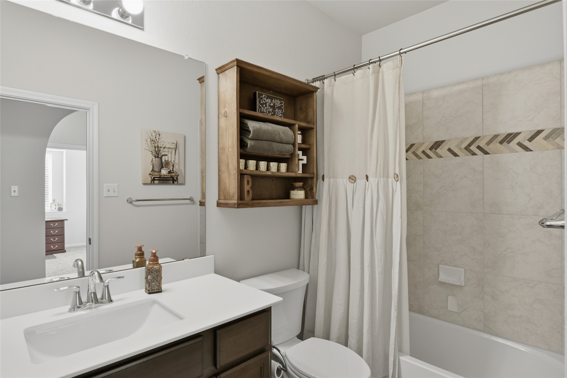 8152 Daisy Cutter Crossing Georgetown, TX 78626 - Photo 6 of 23 a bathroom with a sink toilet and shower