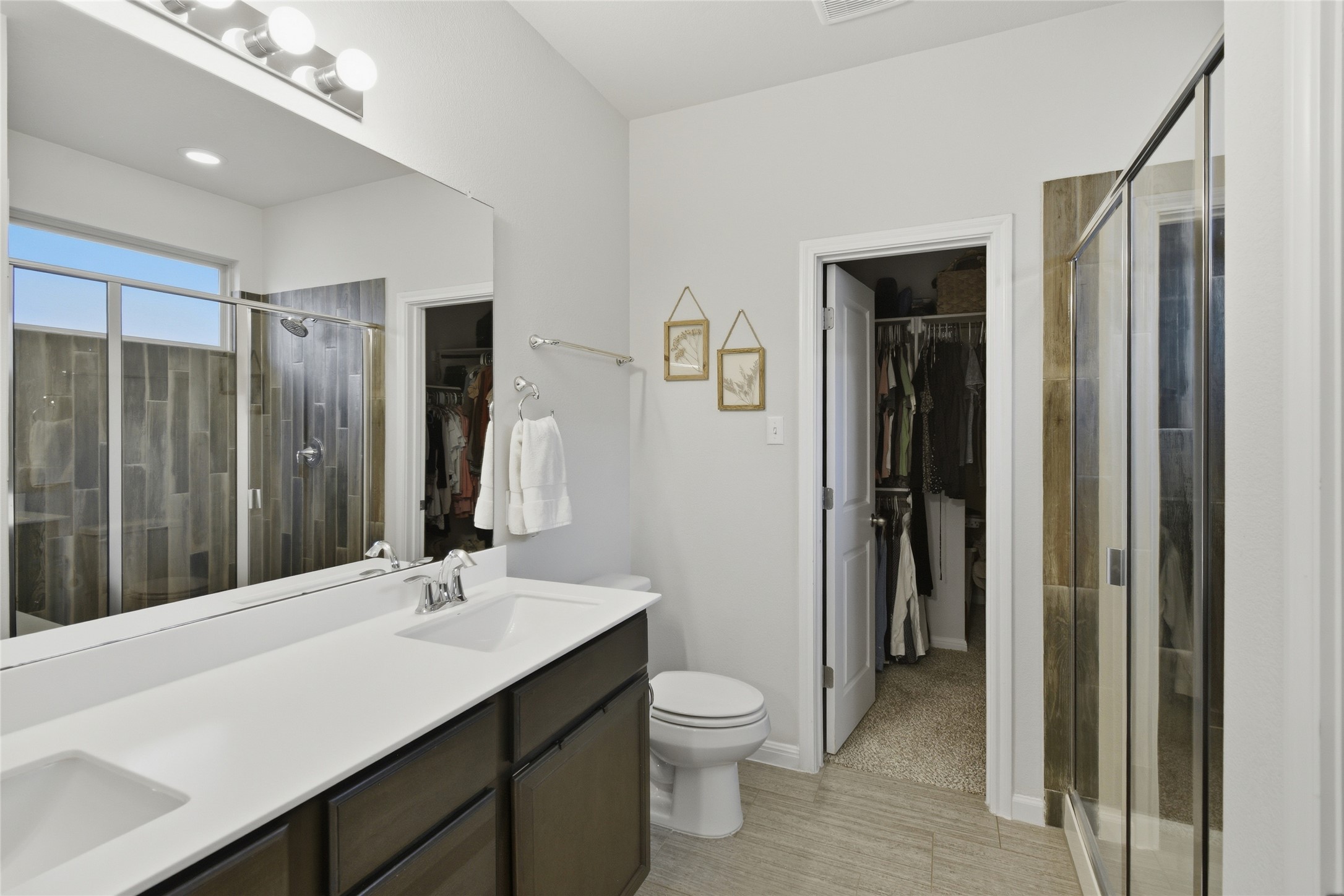 8152 Daisy Cutter Crossing Georgetown, TX 78626 - Photo 10 of 23 a bathroom with a double vanity sink toilet and shower