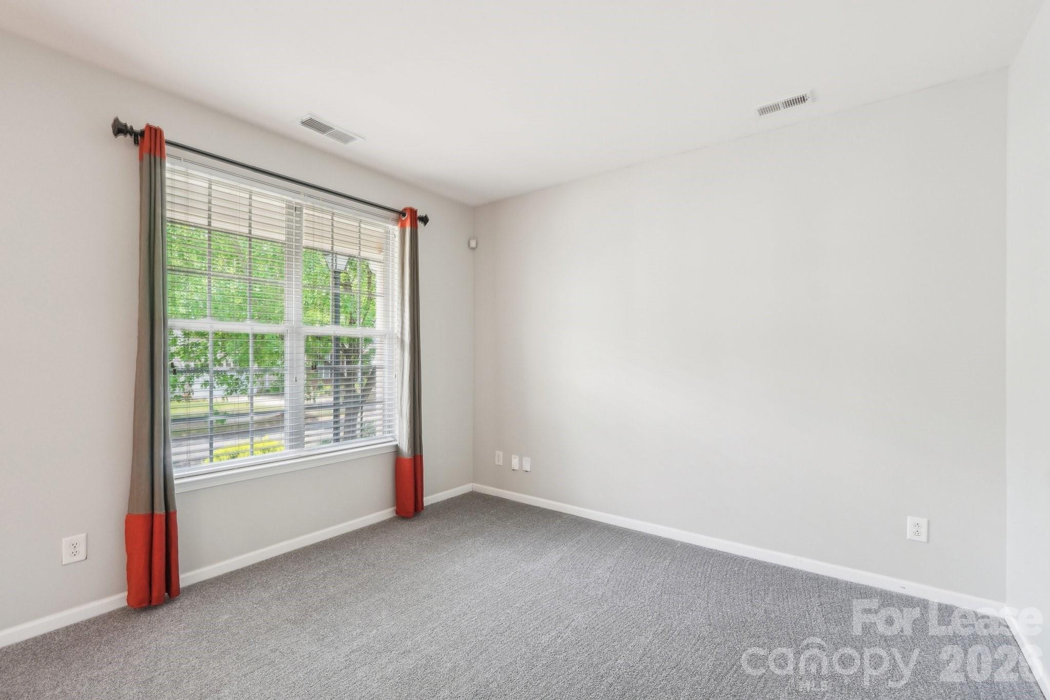 14417 Laurel Tree Lane Huntersville, NC 28078 - Photo 18 of 48 a view of an empty room with a window