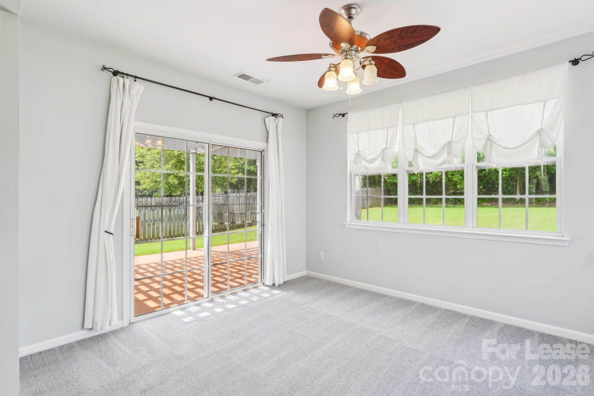 14417 Laurel Tree Lane Huntersville, NC 28078 - Photo 21 of 48 a view of an empty room with a window