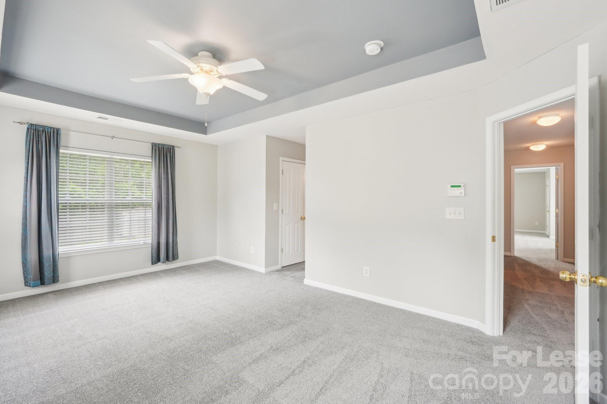 14417 Laurel Tree Lane Huntersville, NC 28078 - Photo 25 of 48 an empty room with fan and windows