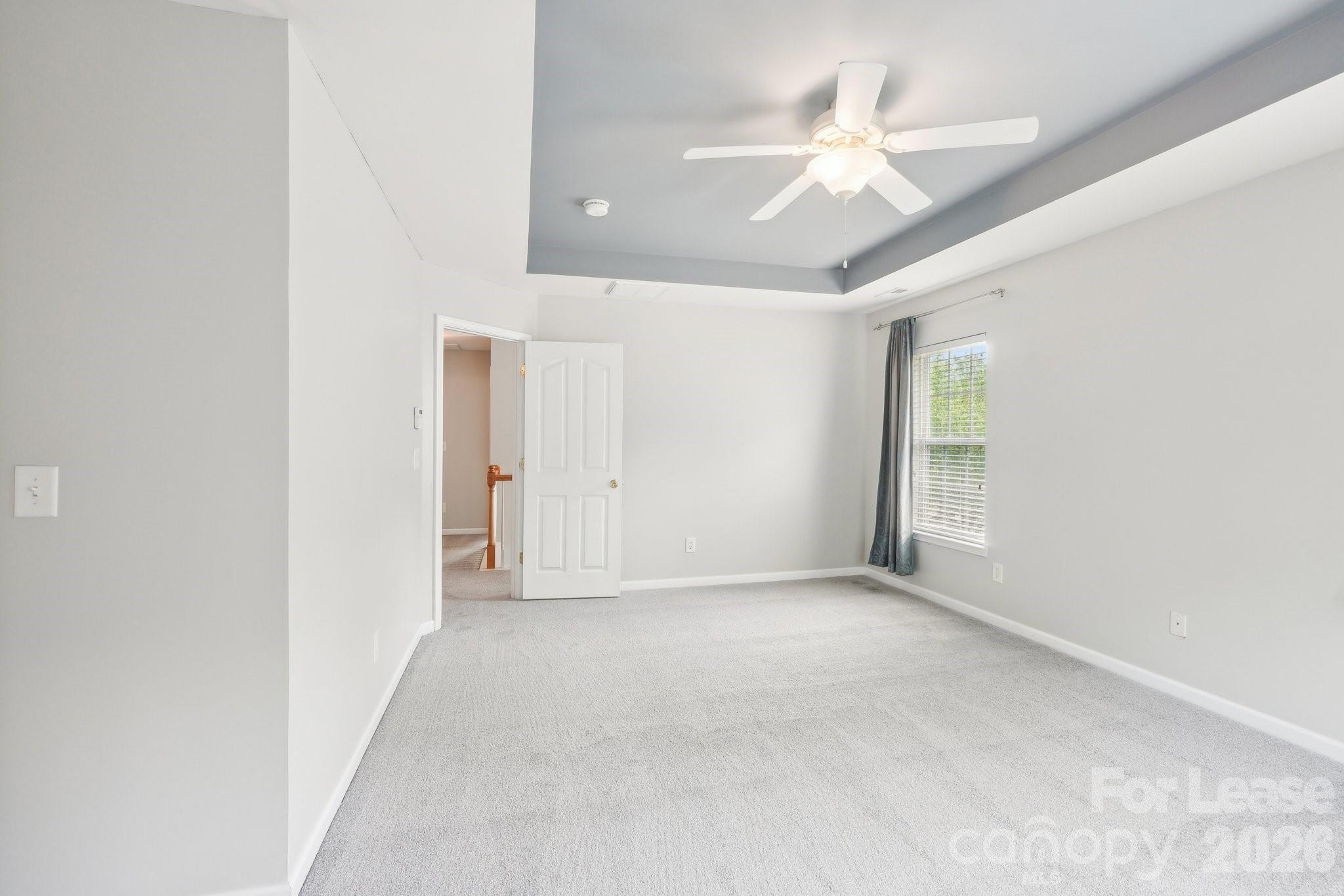 14417 Laurel Tree Lane Huntersville, NC 28078 - Photo 26 of 48 an empty room with fan and windows