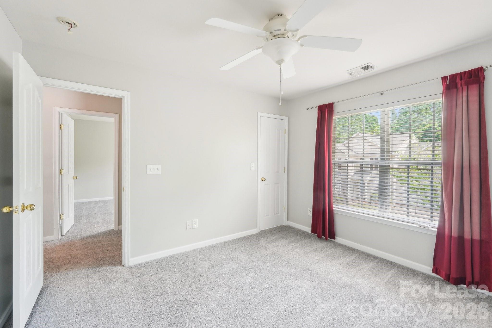 14417 Laurel Tree Lane Huntersville, NC 28078 - Photo 29 of 48 a view of an empty room with a window