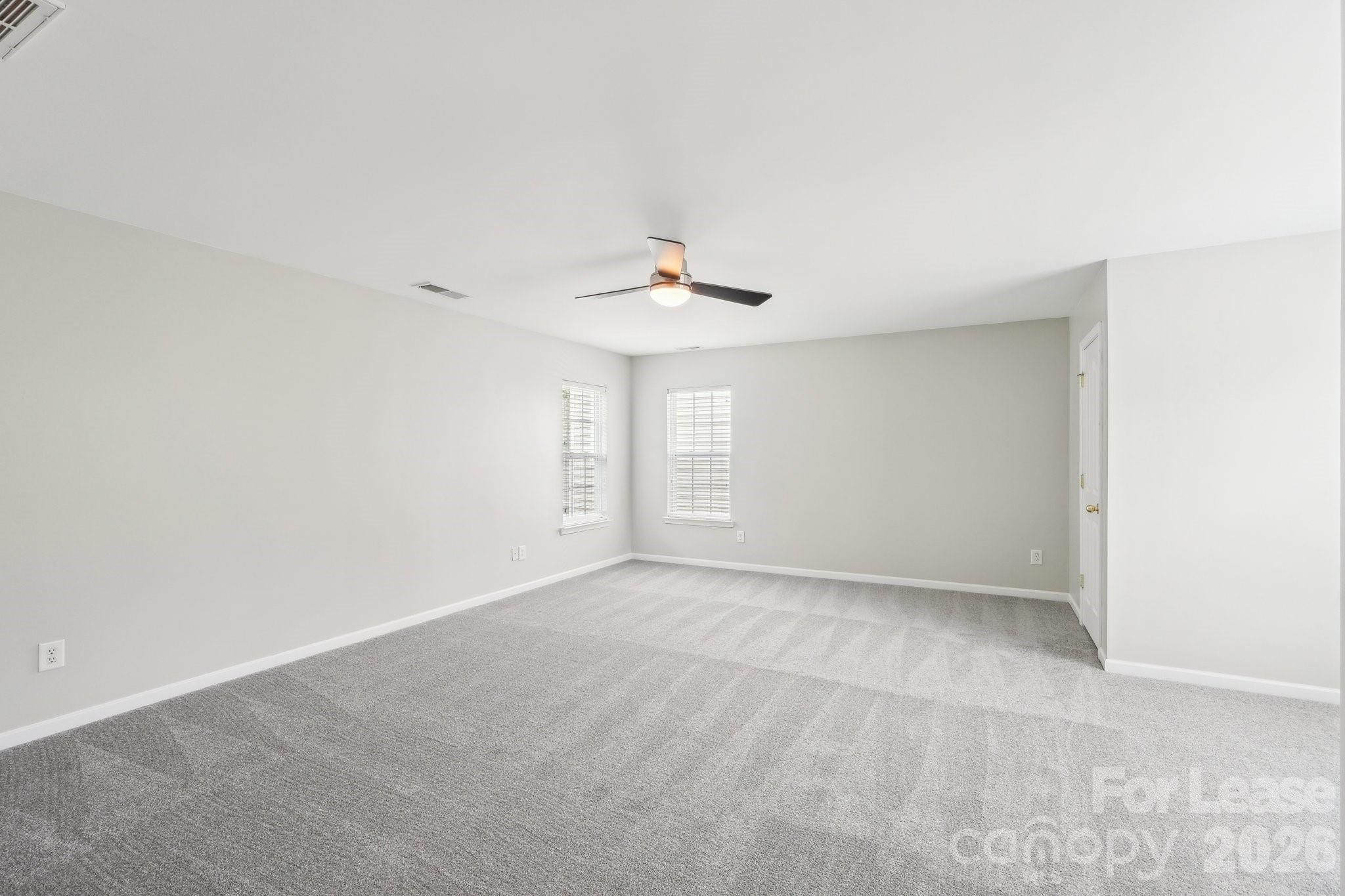14417 Laurel Tree Lane Huntersville, NC 28078 - Photo 32 of 48 a view of an empty room with a window