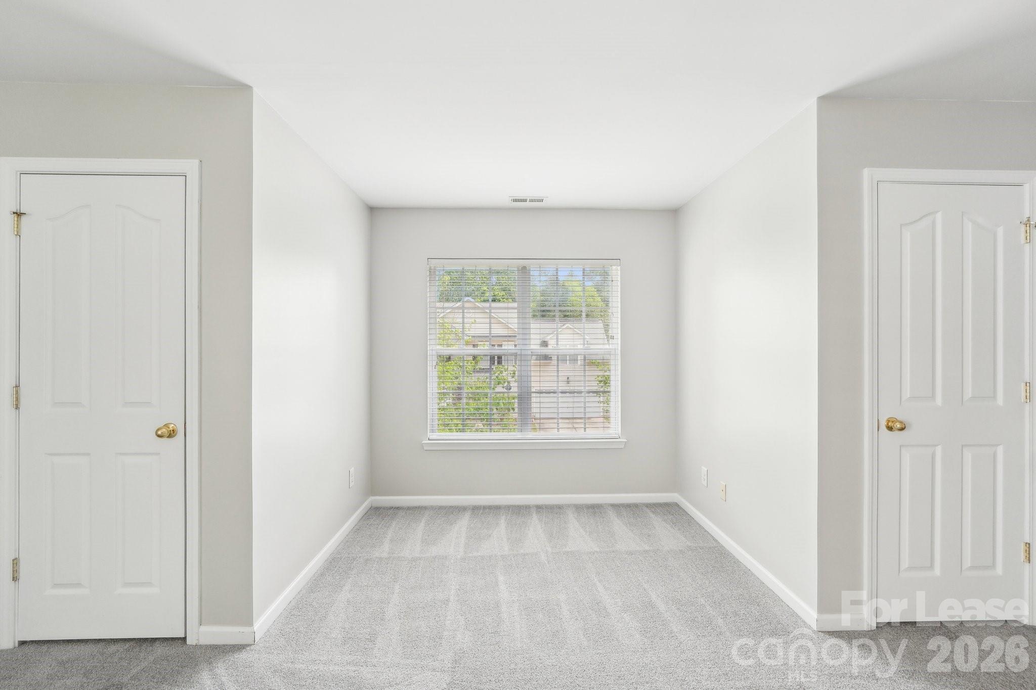 14417 Laurel Tree Lane Huntersville, NC 28078 - Photo 34 of 48 an empty room with a window