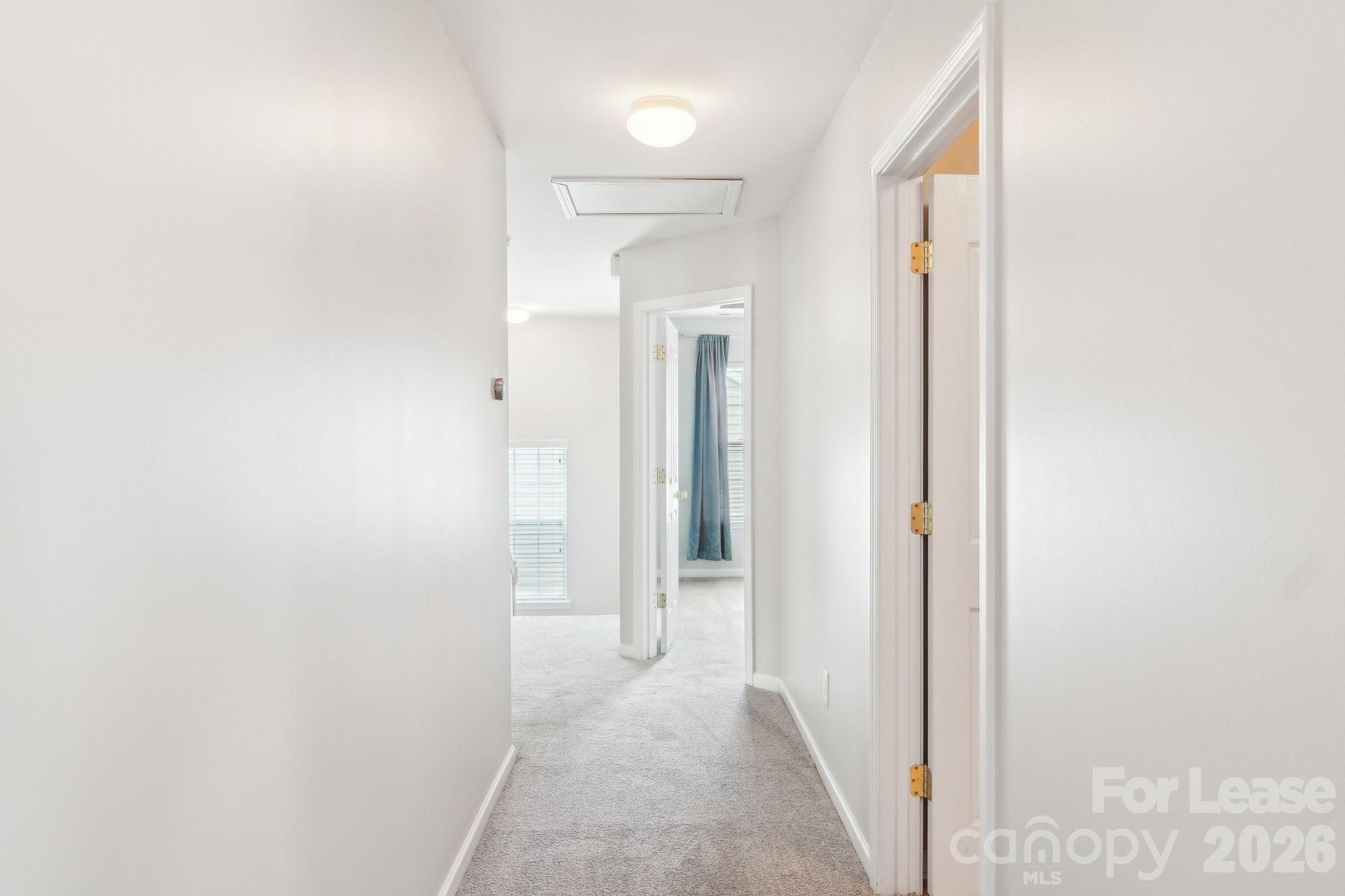 14417 Laurel Tree Lane Huntersville, NC 28078 - Photo 36 of 48 a view of a hallway with wooden floor