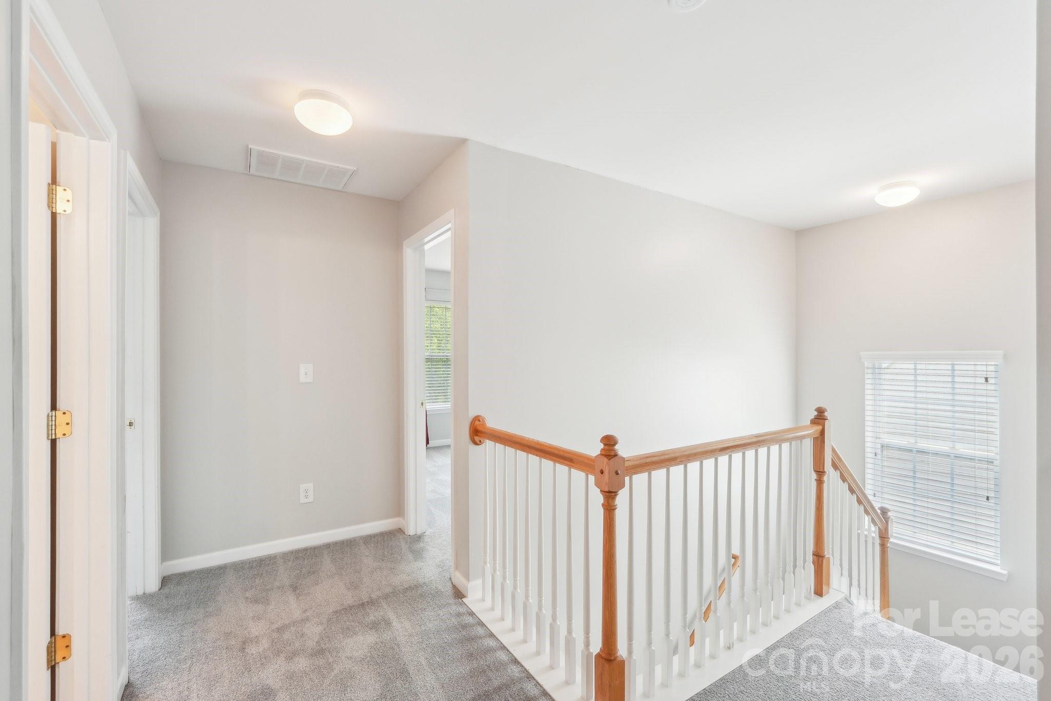 14417 Laurel Tree Lane Huntersville, NC 28078 - Photo 37 of 48 a view of a hallway with a window