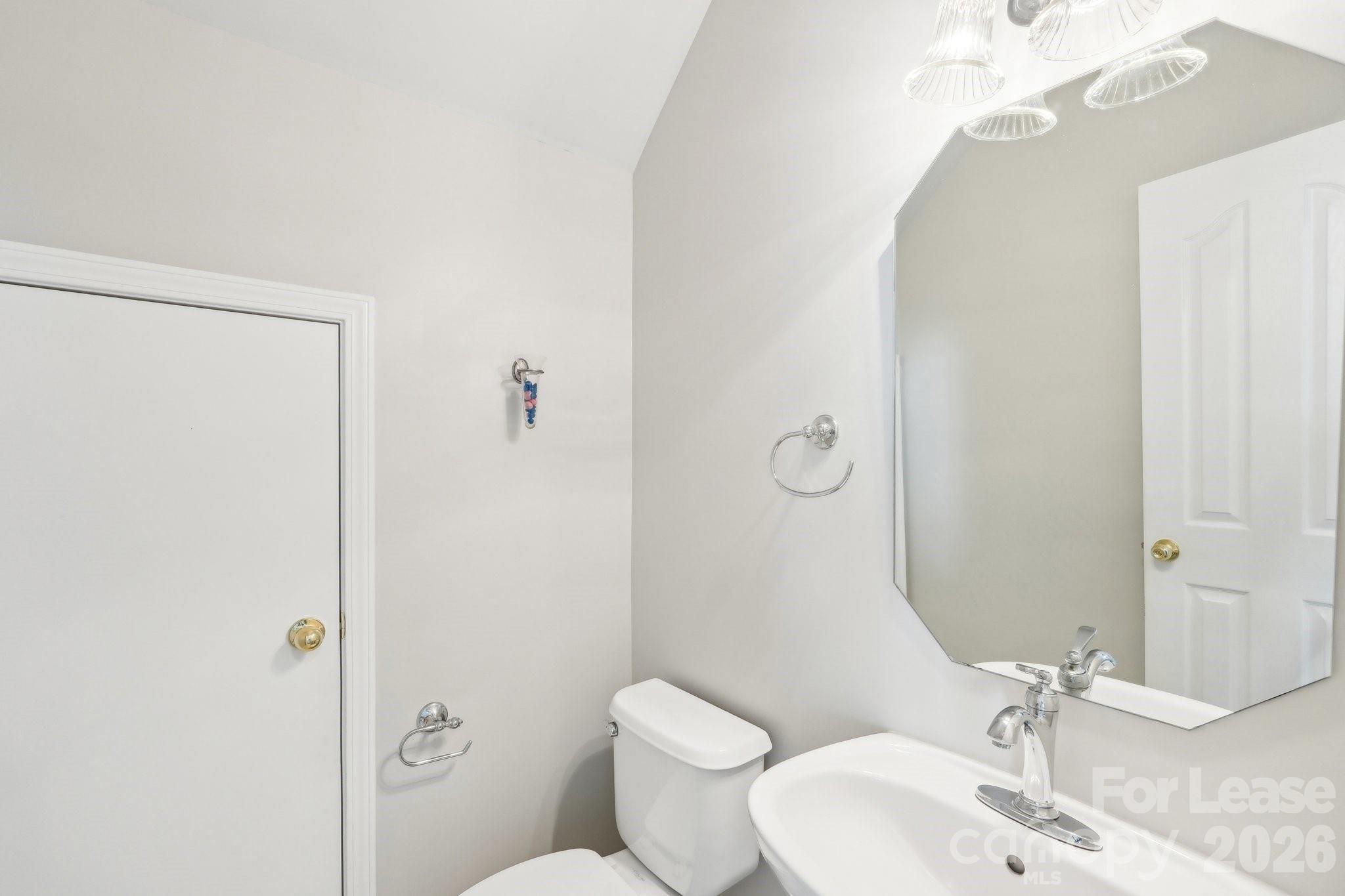 14417 Laurel Tree Lane Huntersville, NC 28078 - Photo 38 of 48 a bathroom with a toilet sink and shower