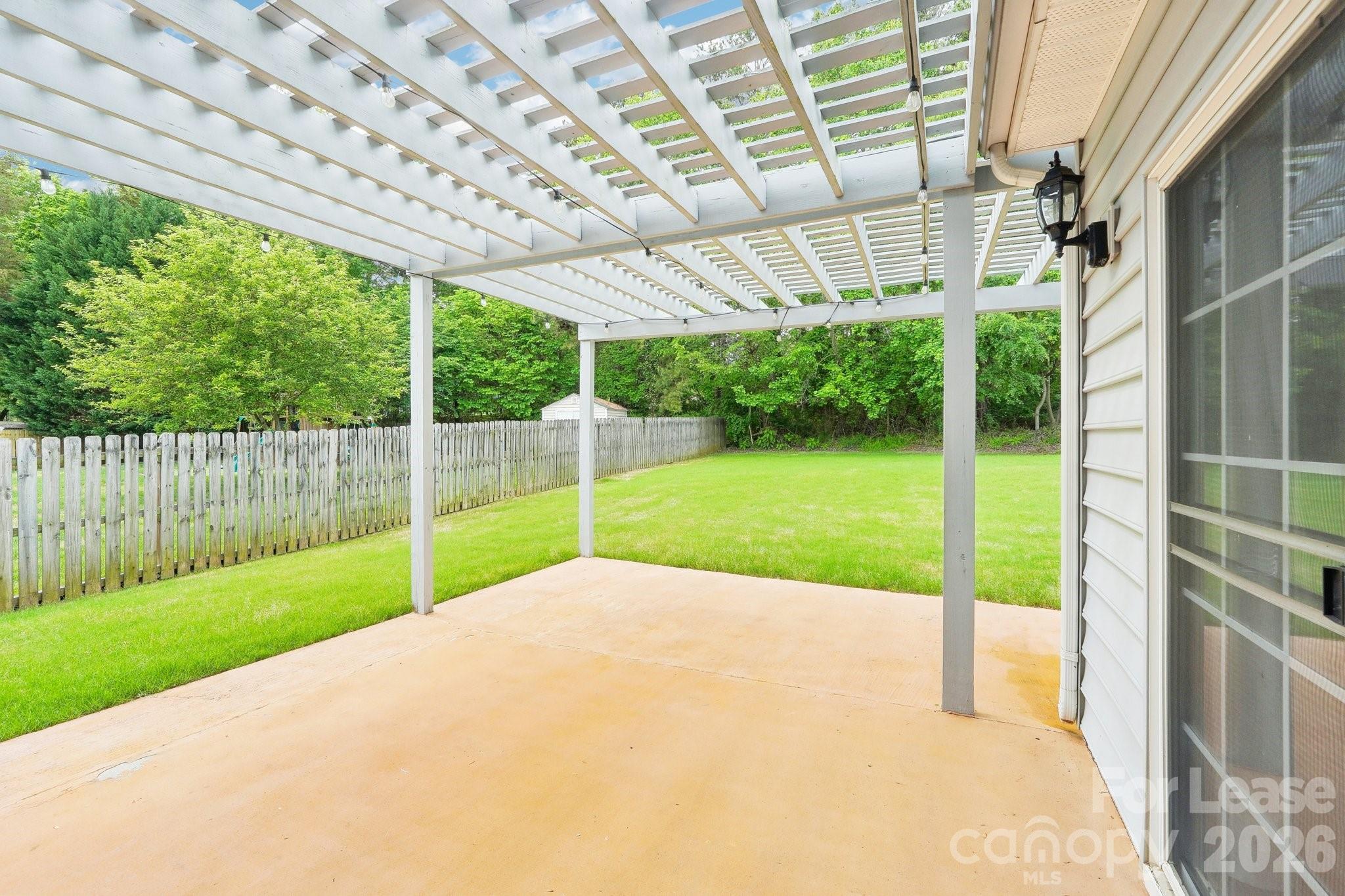 14417 Laurel Tree Lane Huntersville, NC 28078 - Photo 43 of 48 a view of a backyard with a small cabin