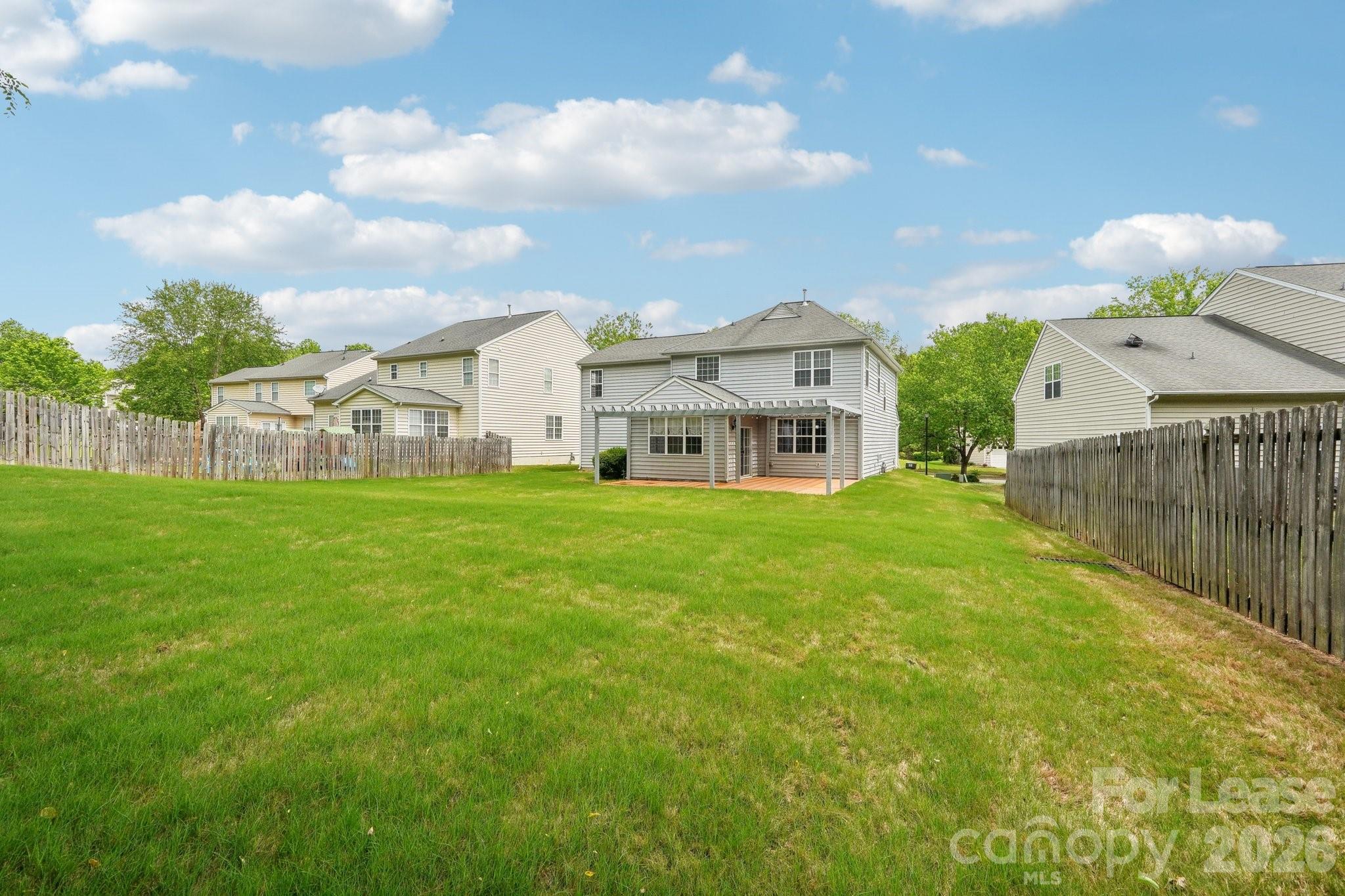 14417 Laurel Tree Lane Huntersville, NC 28078 - Photo 46 of 48 a view of a house with a yard